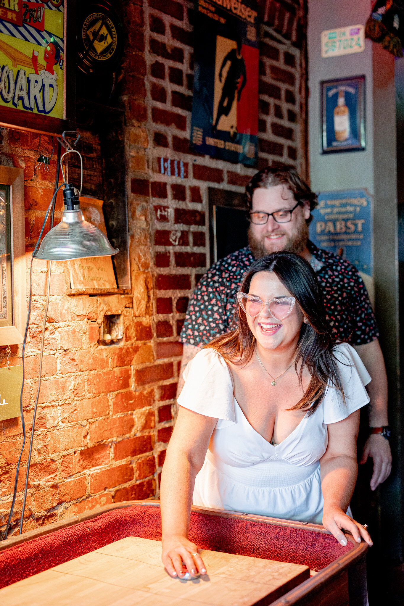 Tulsa Oklahoma unique engagement session idea at a local bar in Blue Dome District downtown Tulsa