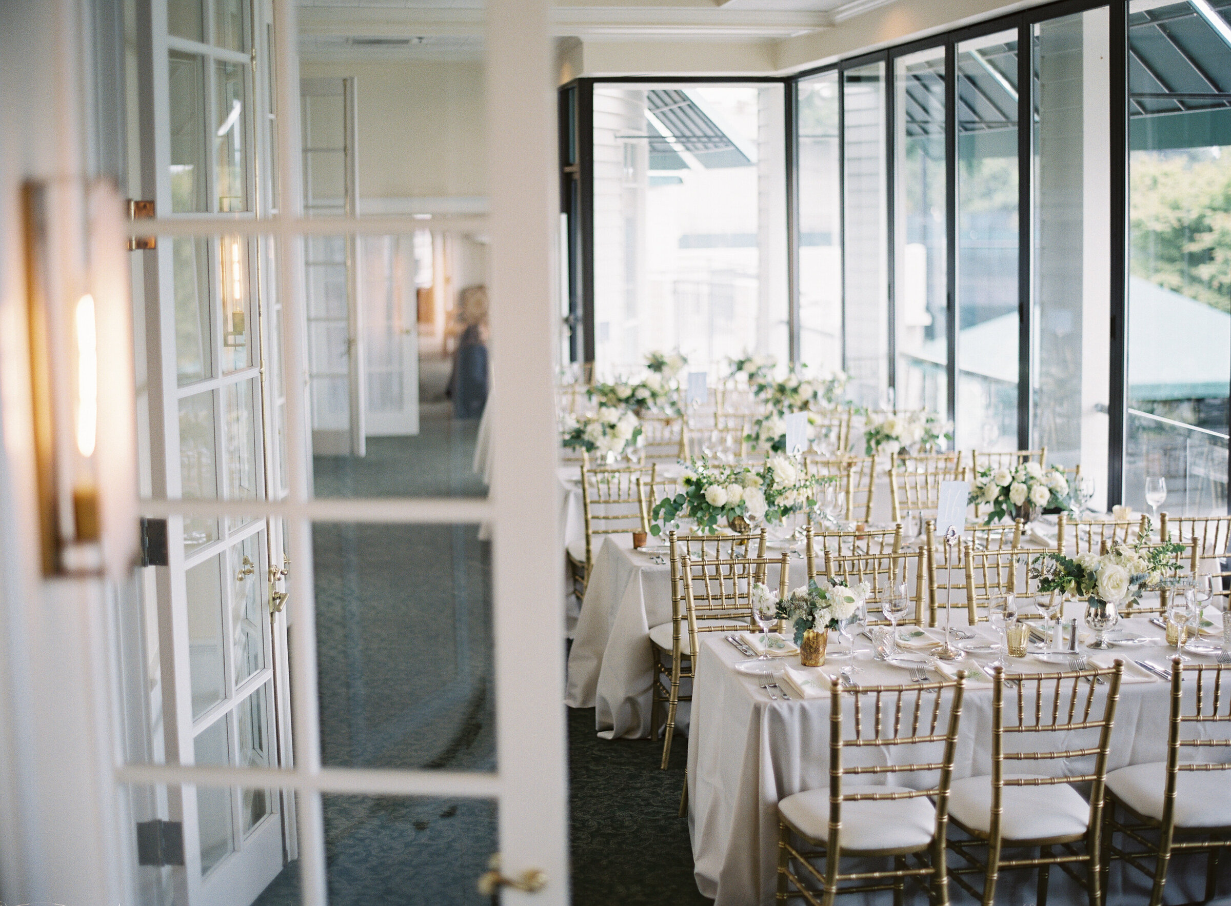 wedding reception tables inside window room