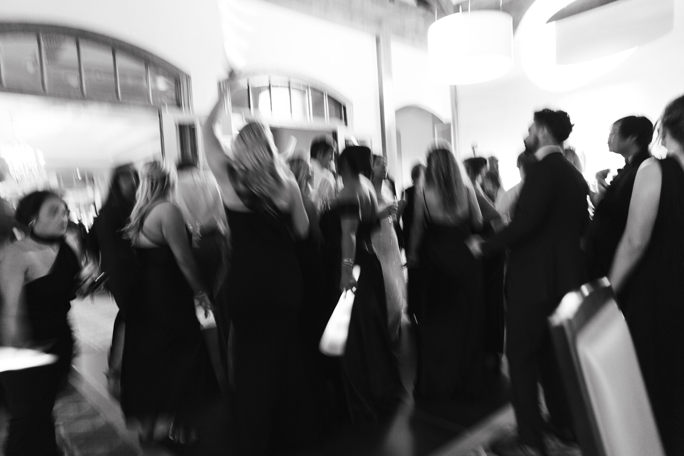 wedding guests dancing on a dance floor at Prestonwood Country Club in Cary,NC by cary wedding photographer