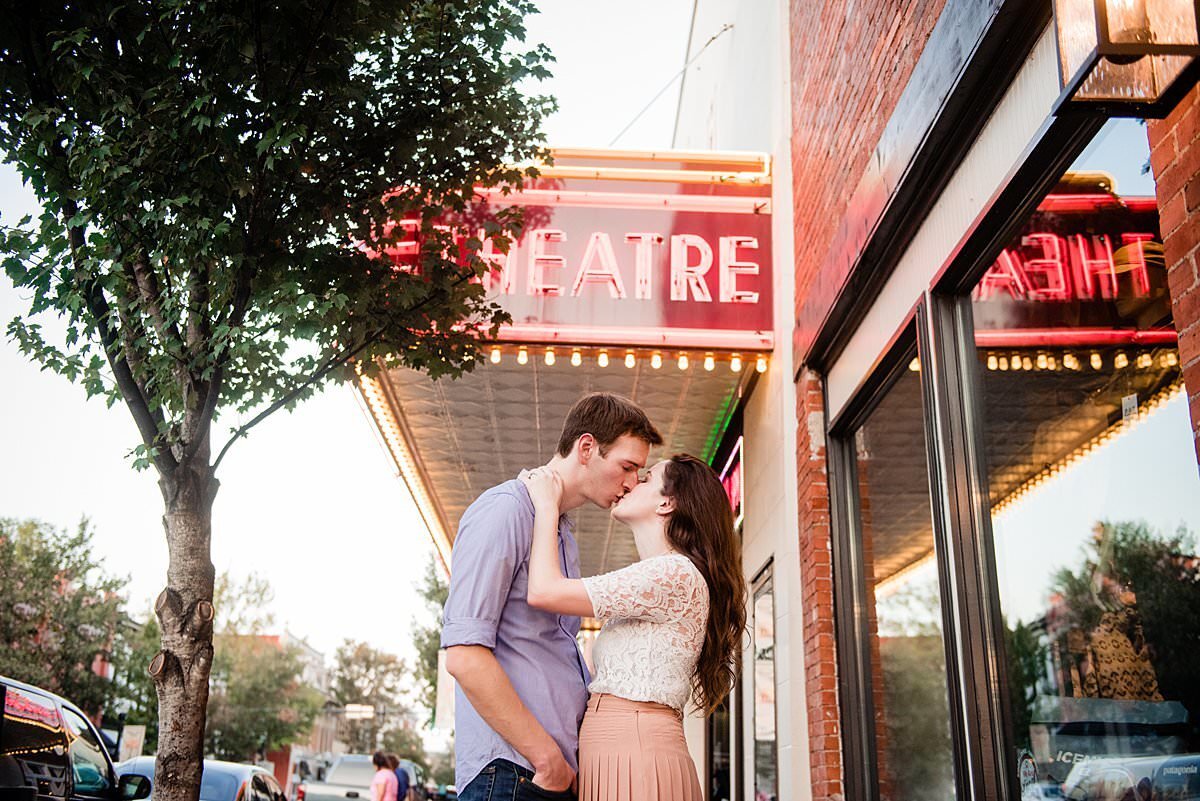 Couple kissing in front of the  historic theater in downtown Franklin