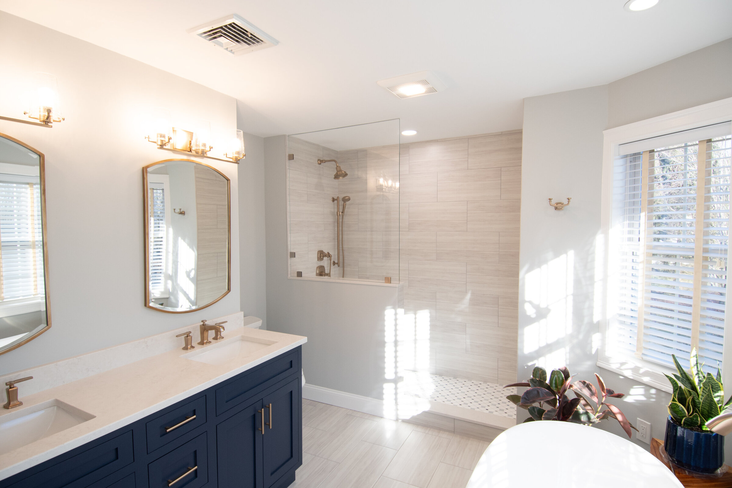 Full bathroom design with walk in shower, standalone tub, and gorgeous double vanity.