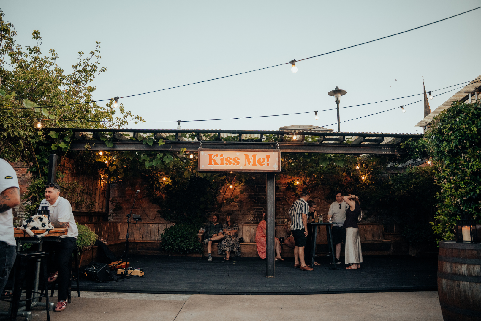 Courtyard and Kiss Me sign