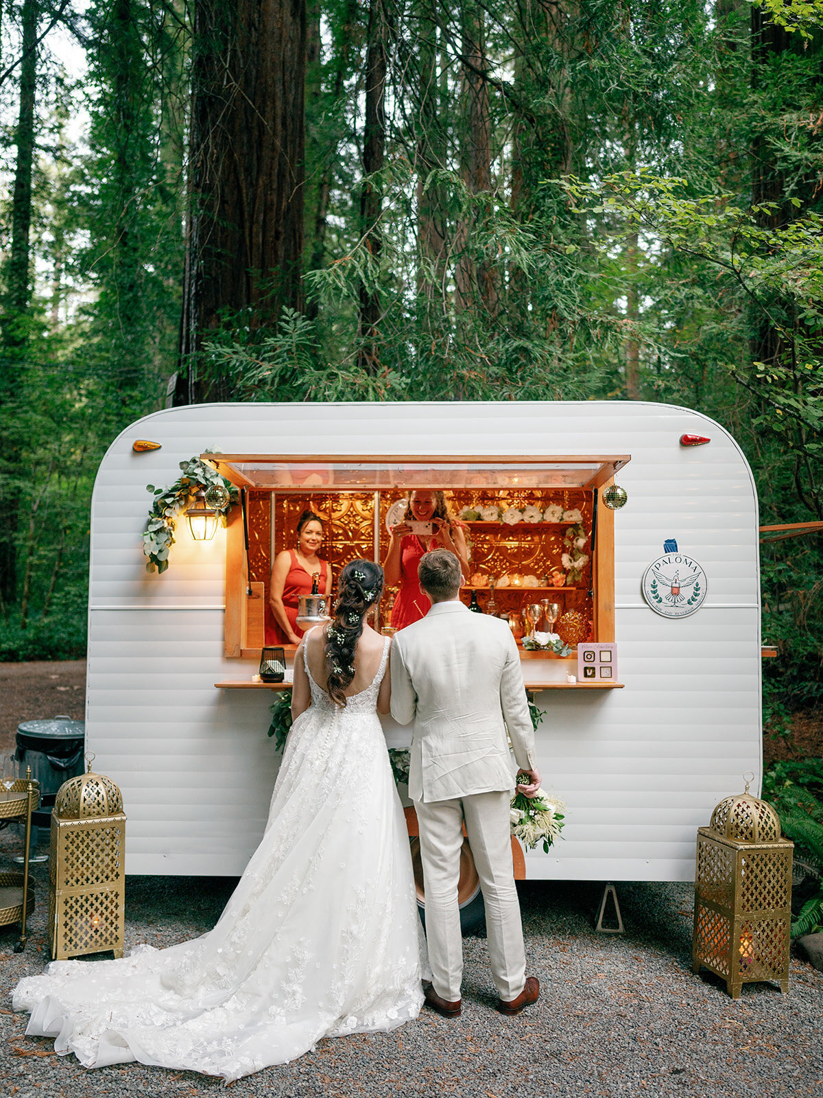 Bride and groom getting a drink at a mobile bar for a wedding in Redwood, California