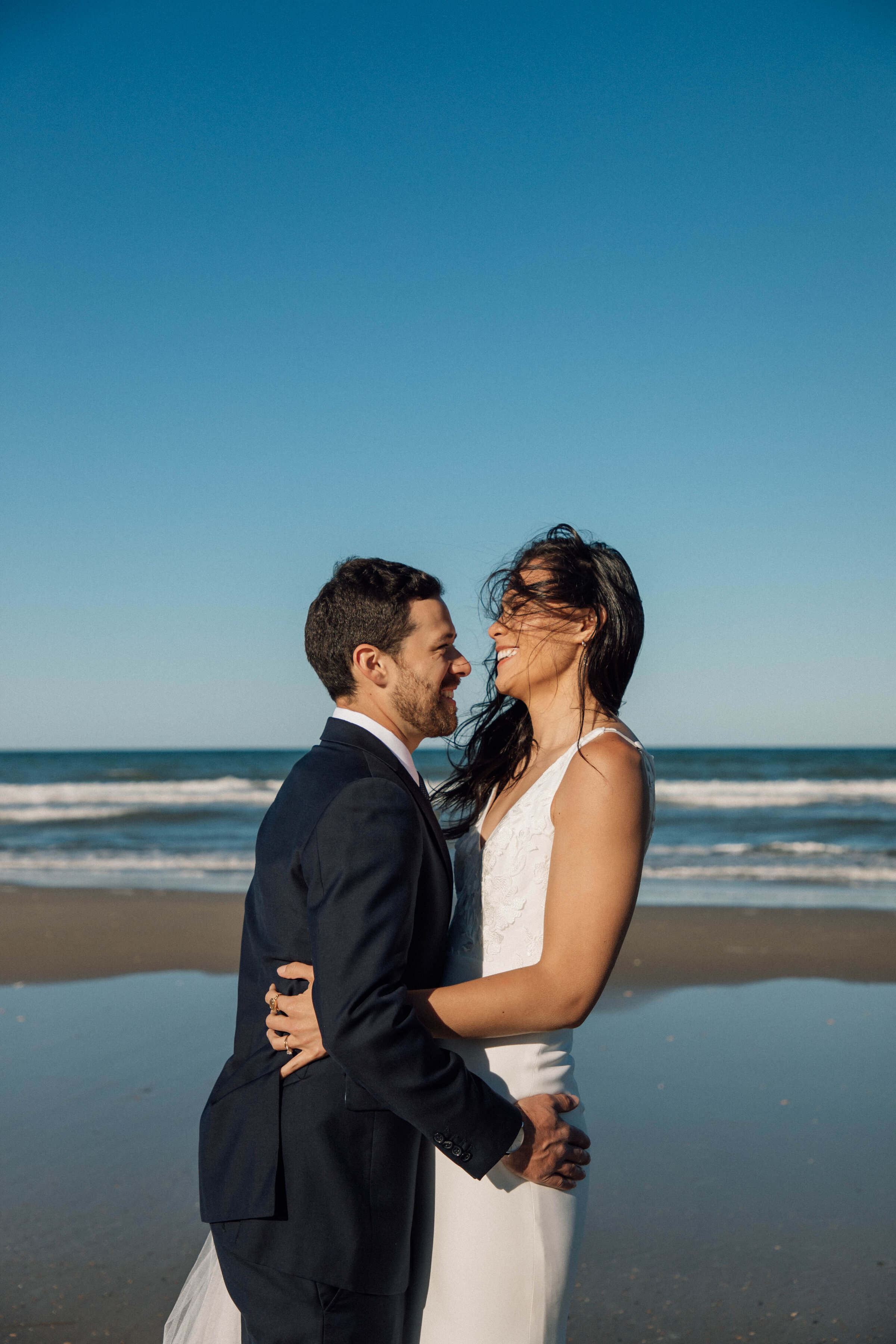direct sunlight bride and groom Portraits, outer banks wedding in north carolina summer wedding
