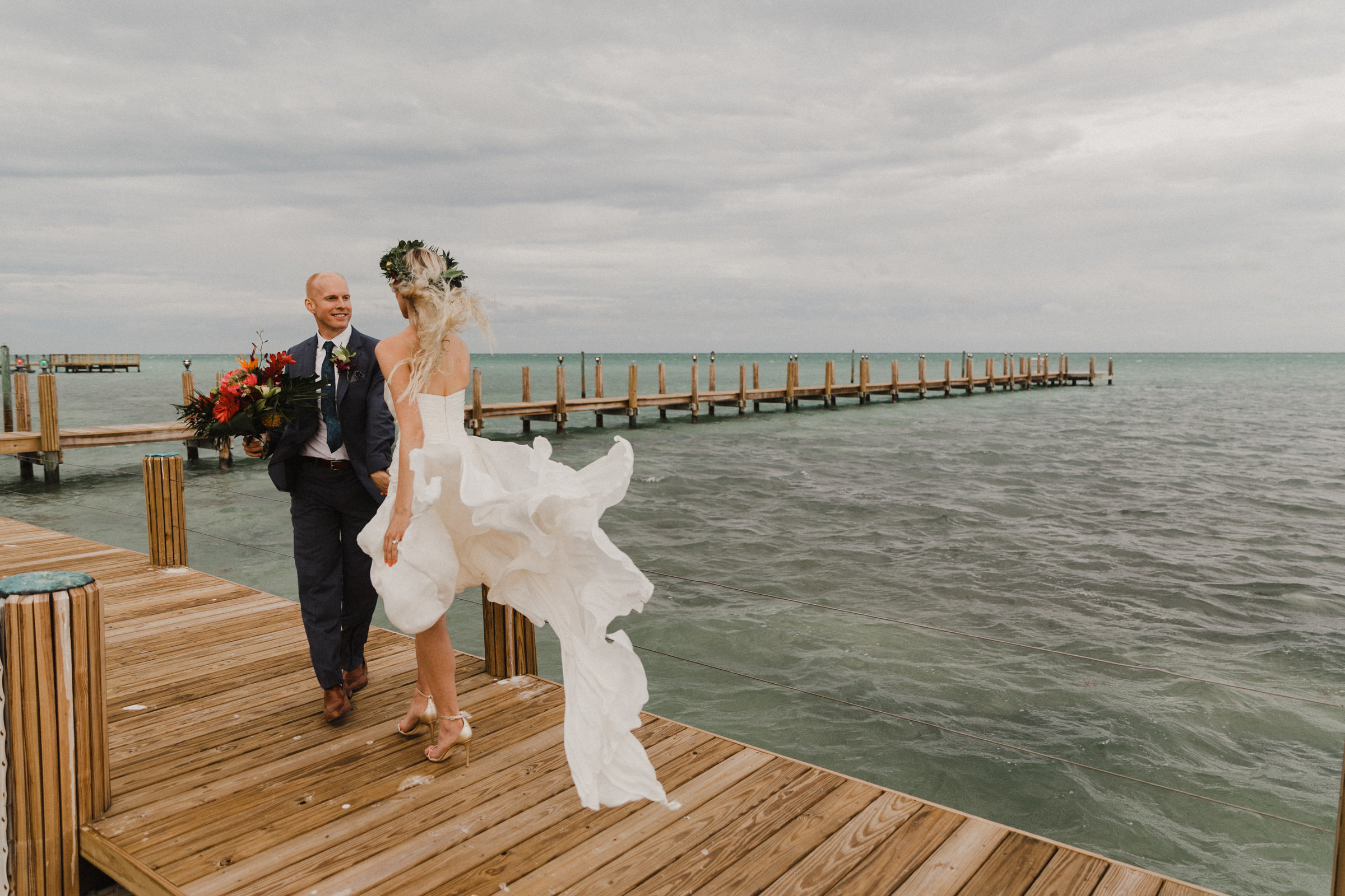 wind plays with bride and groom during photo session