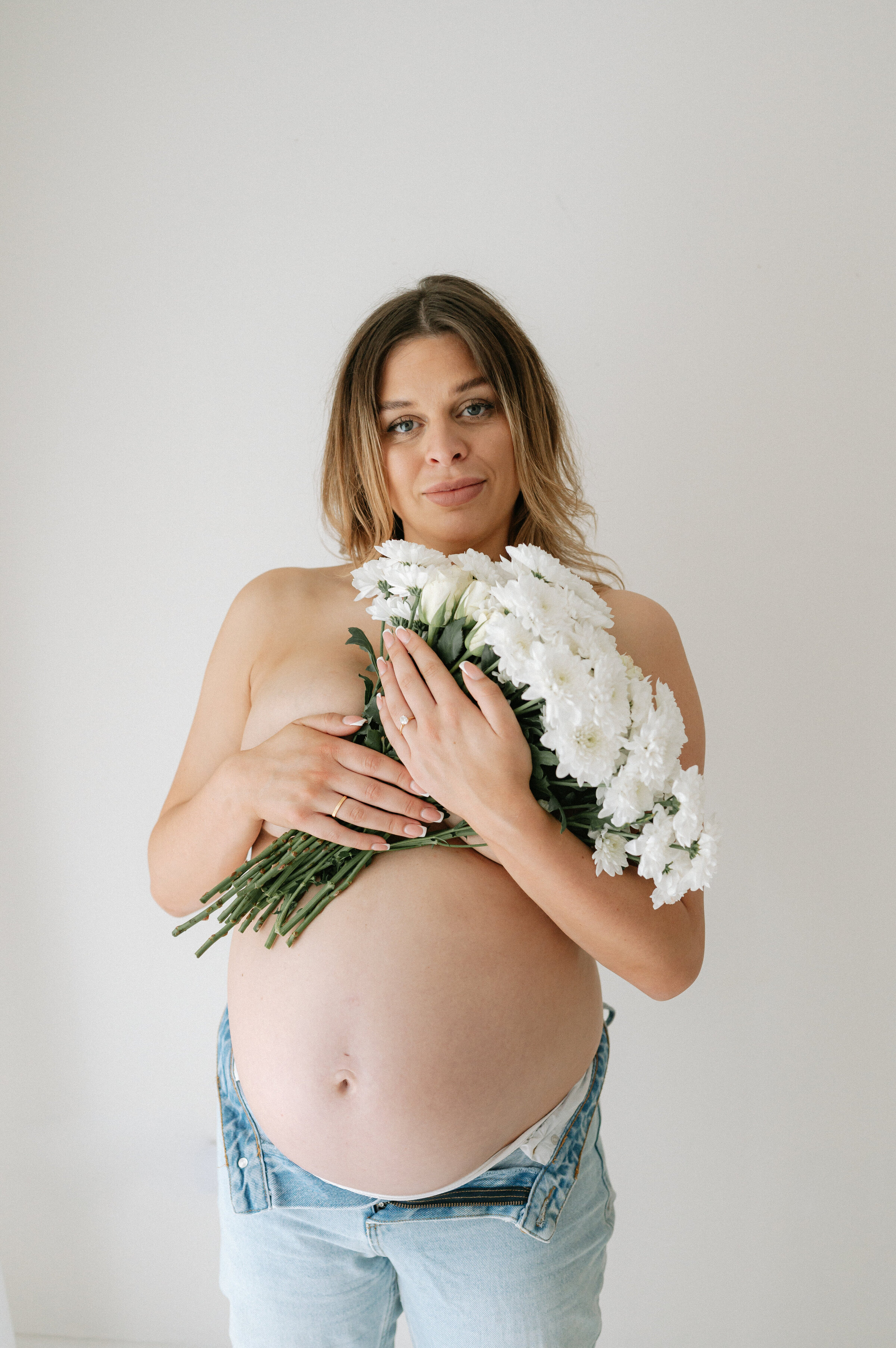 york Mum who is pregnant holding beautiful flowers