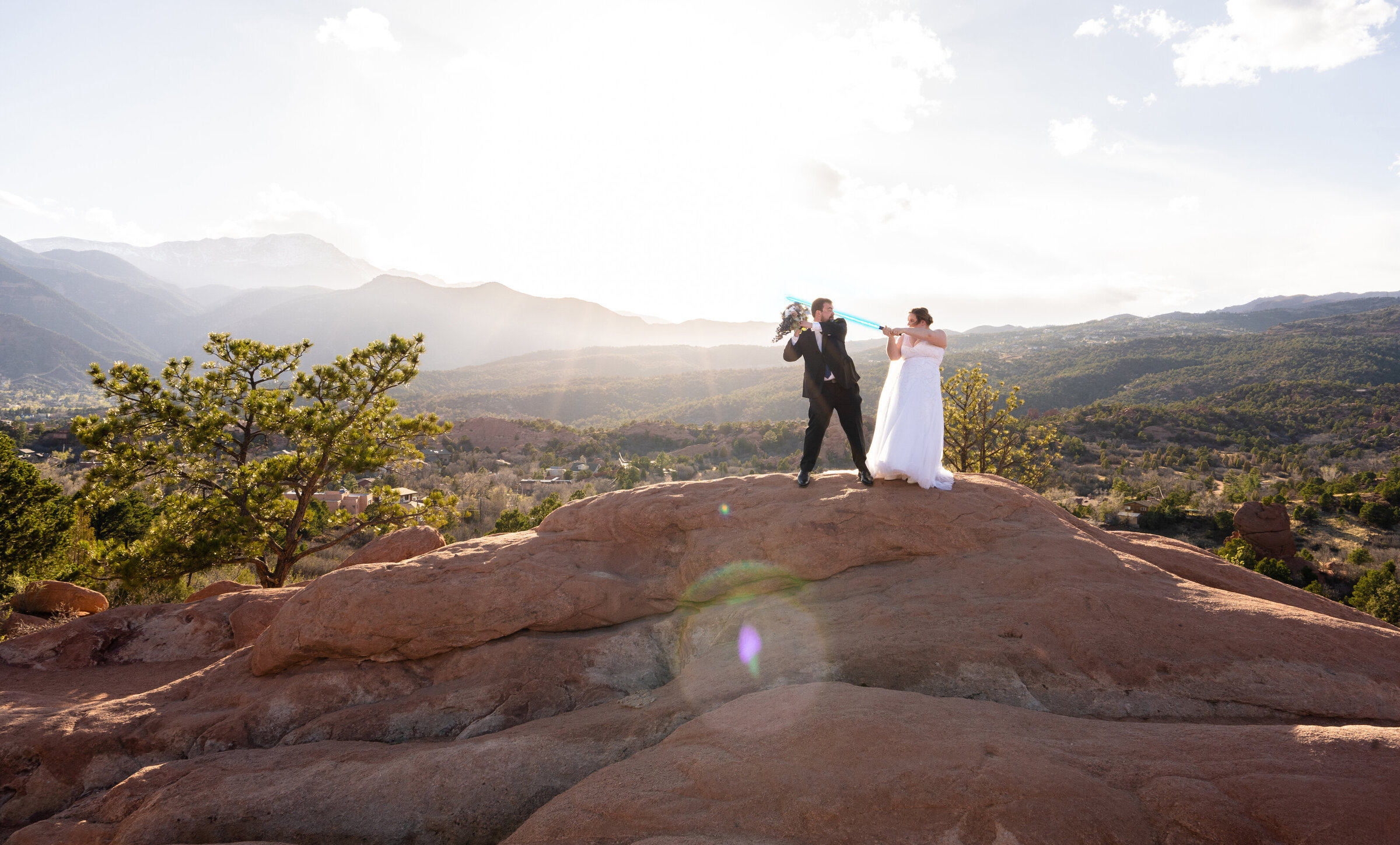 Adventurous Couple walking through a rainstorm while smiling and laughing, epic & fun Colorado Springs Wedding Photography