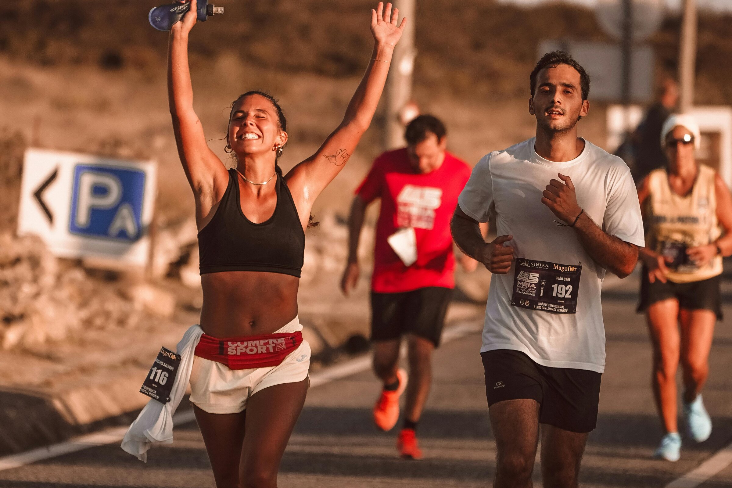 A woman runner thrilled to have finished a race