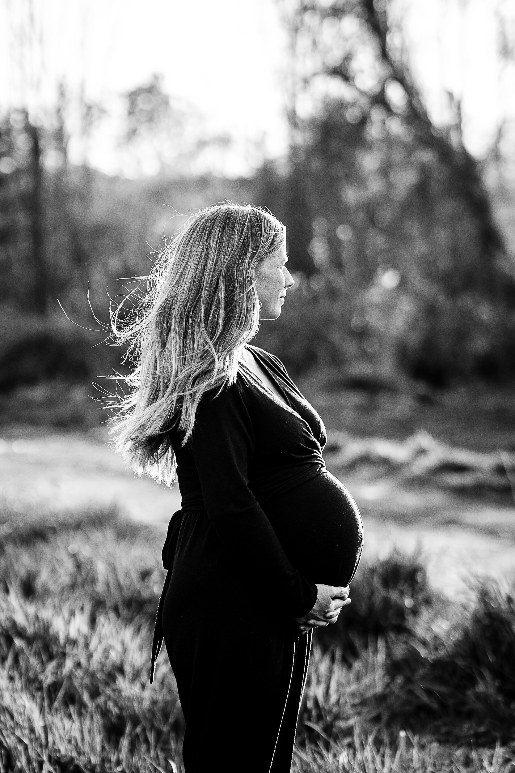black and white portrait of a pregnant womans profile