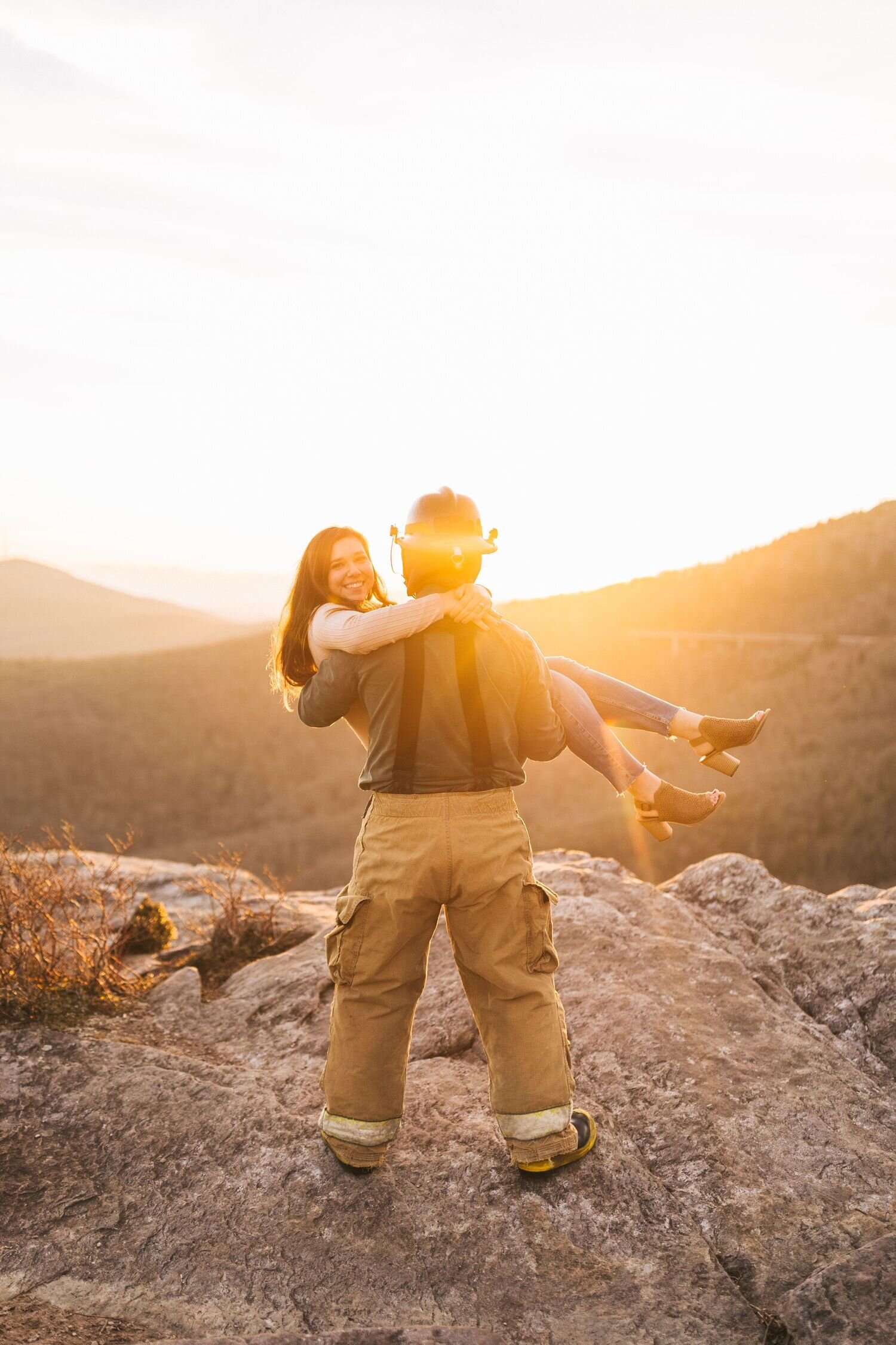 firefighter picking up his fiance