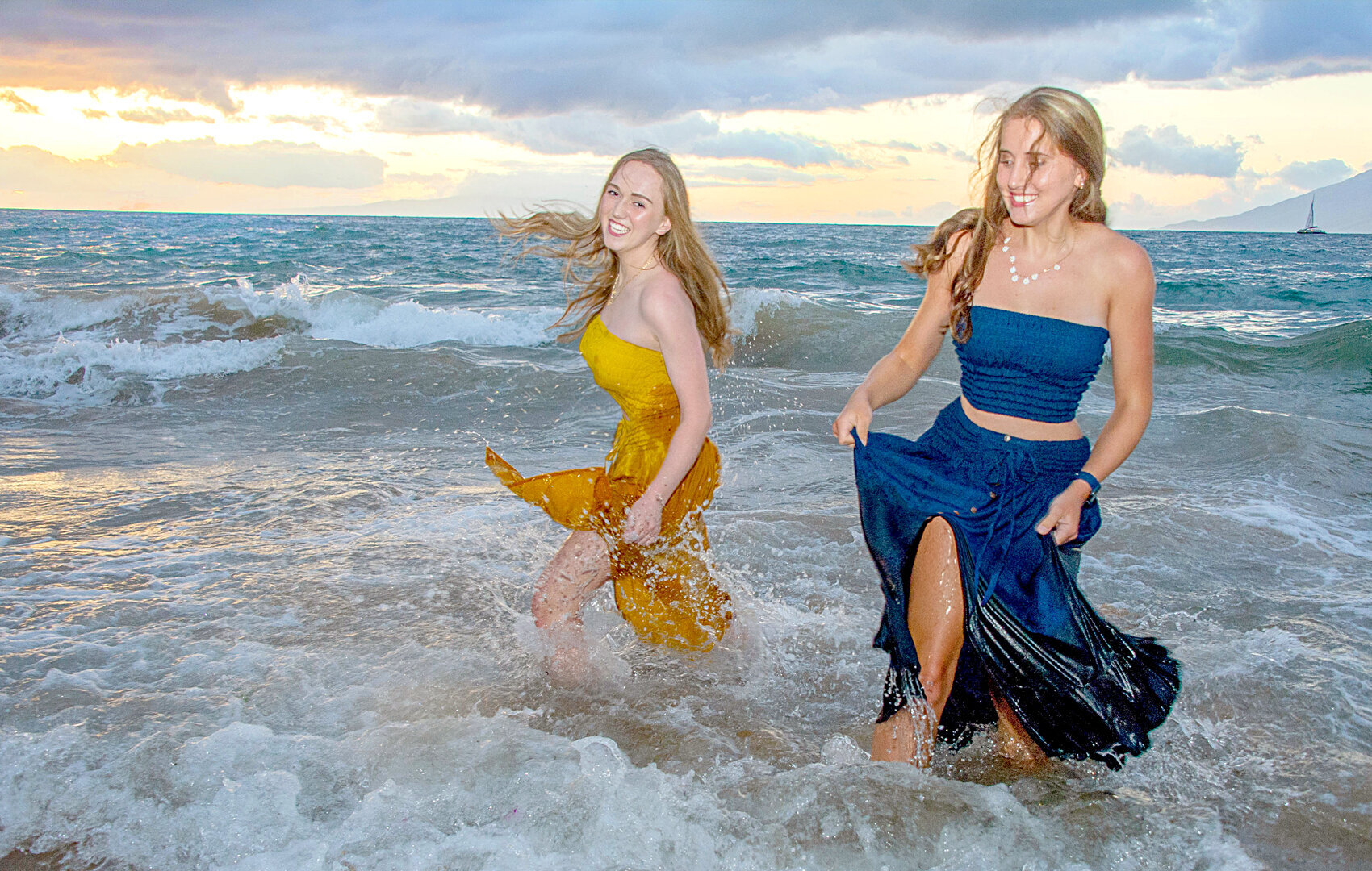 Getting very wet and lots of laughter in their blue and yellow dresses they bought for their photoshoot.