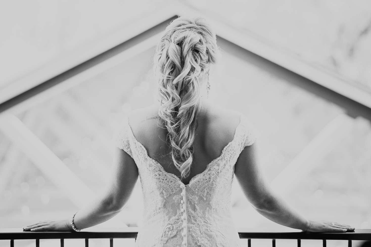 "Bride overlooks the reception at her wedding at the Barn at Rock Creek in Brunswick county"