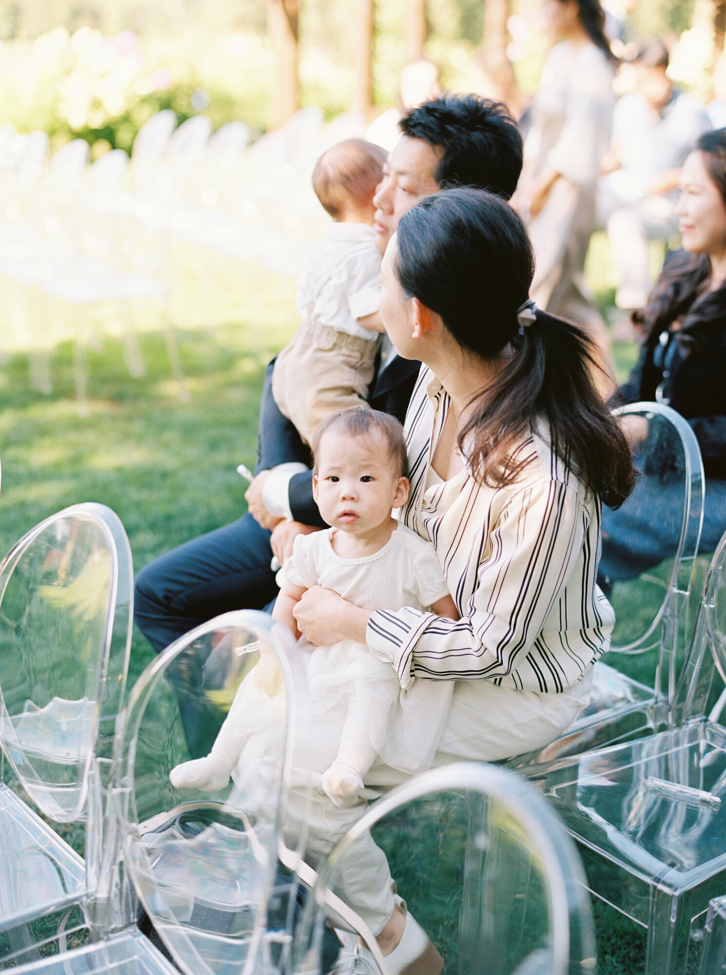 candids of guests at wedding ceremony baby