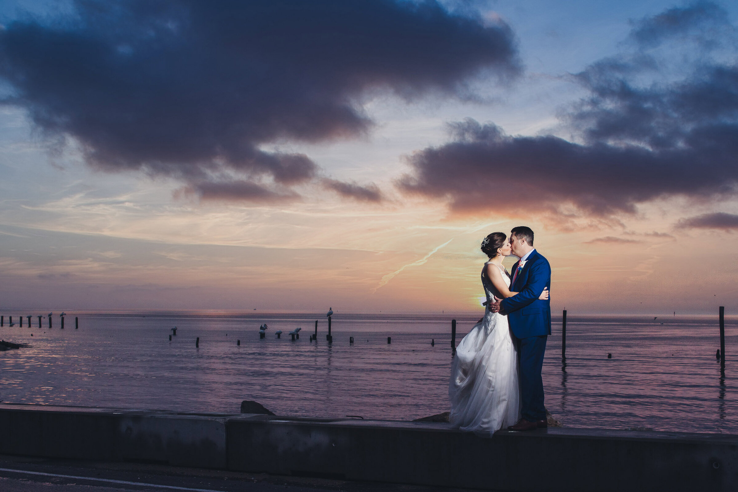 romantic bride and groom by the bay
