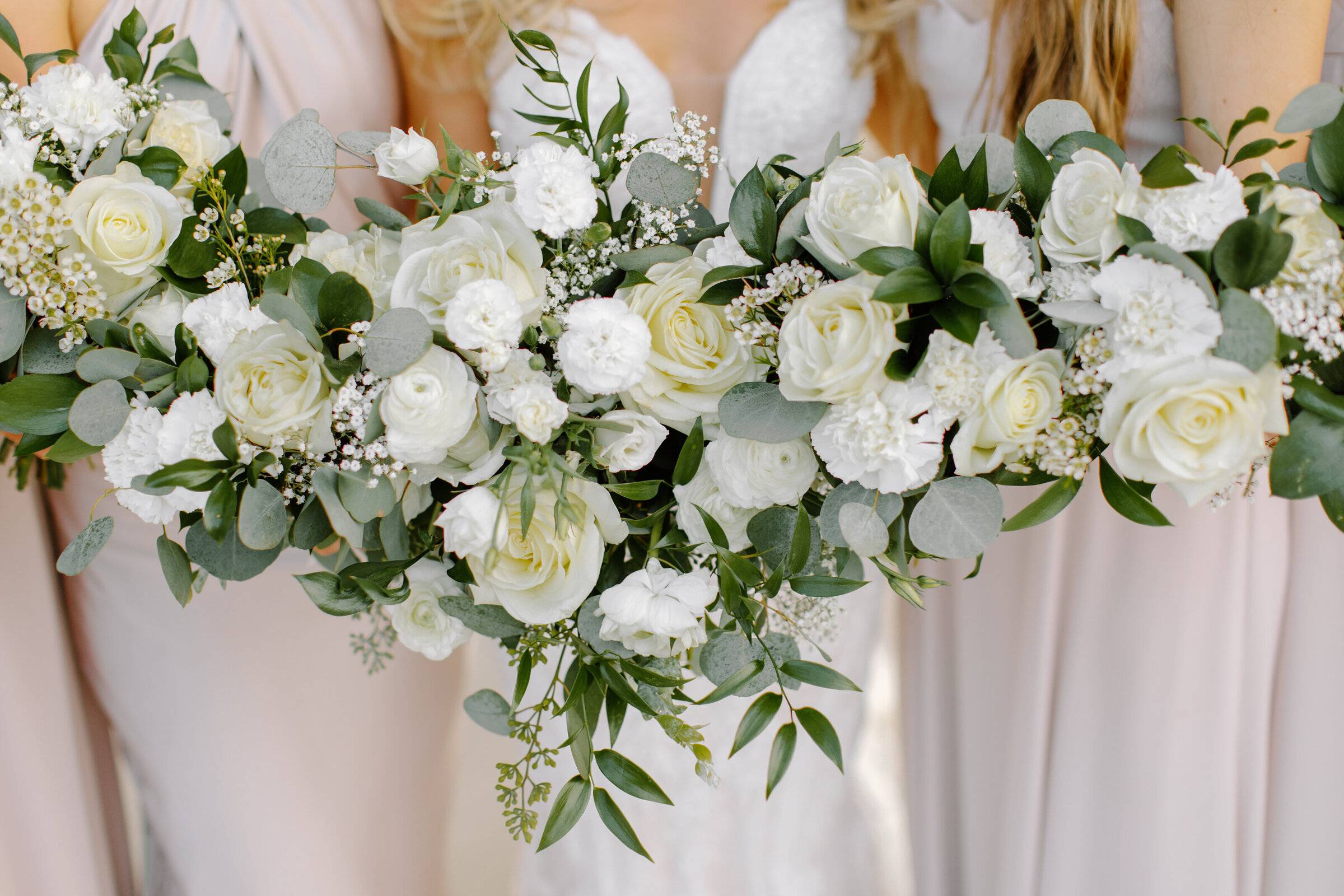 Close up photo of classic cream and white bouquets