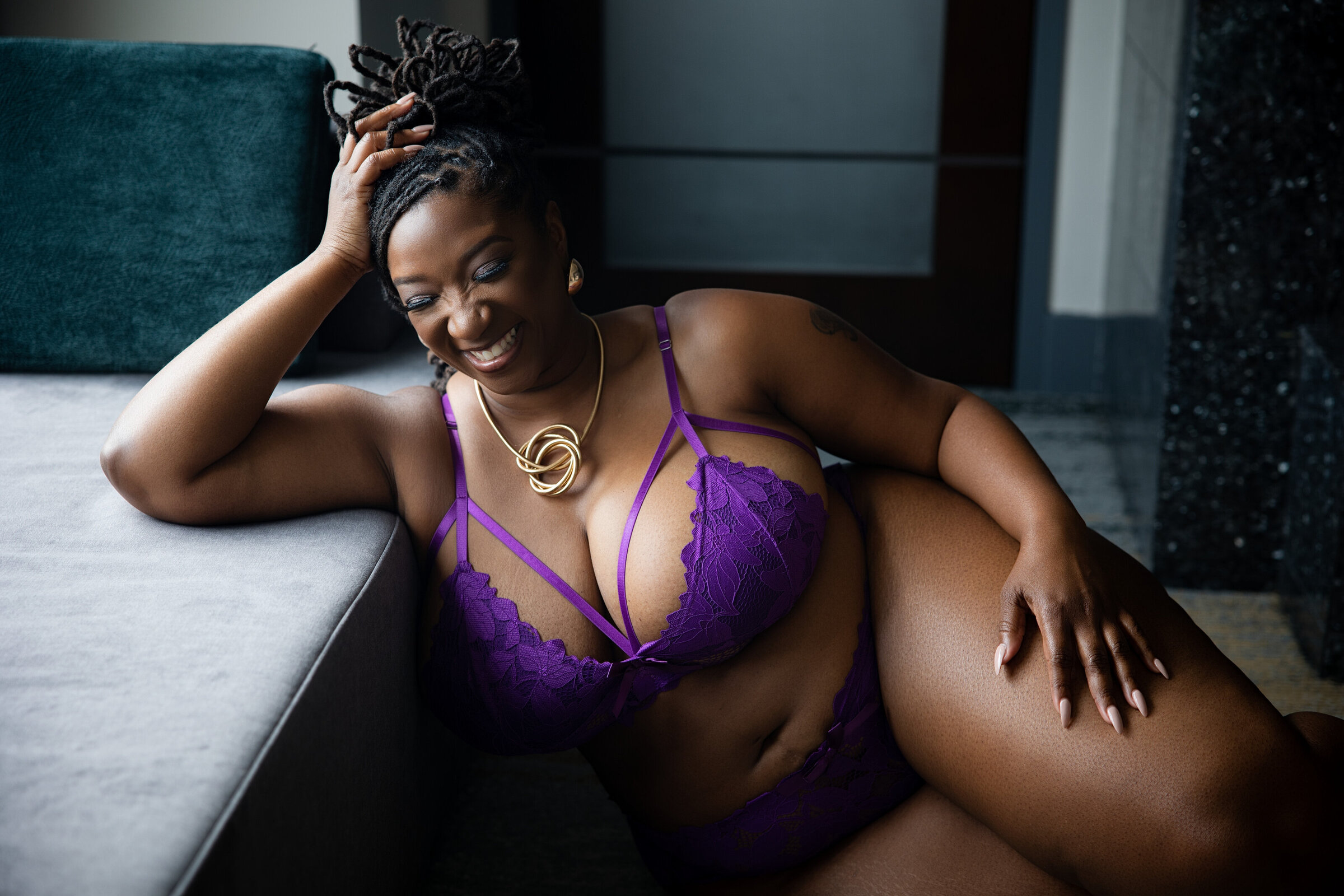 Woman smiling during her DC boudoir photography session with Nicole Griffin Photography