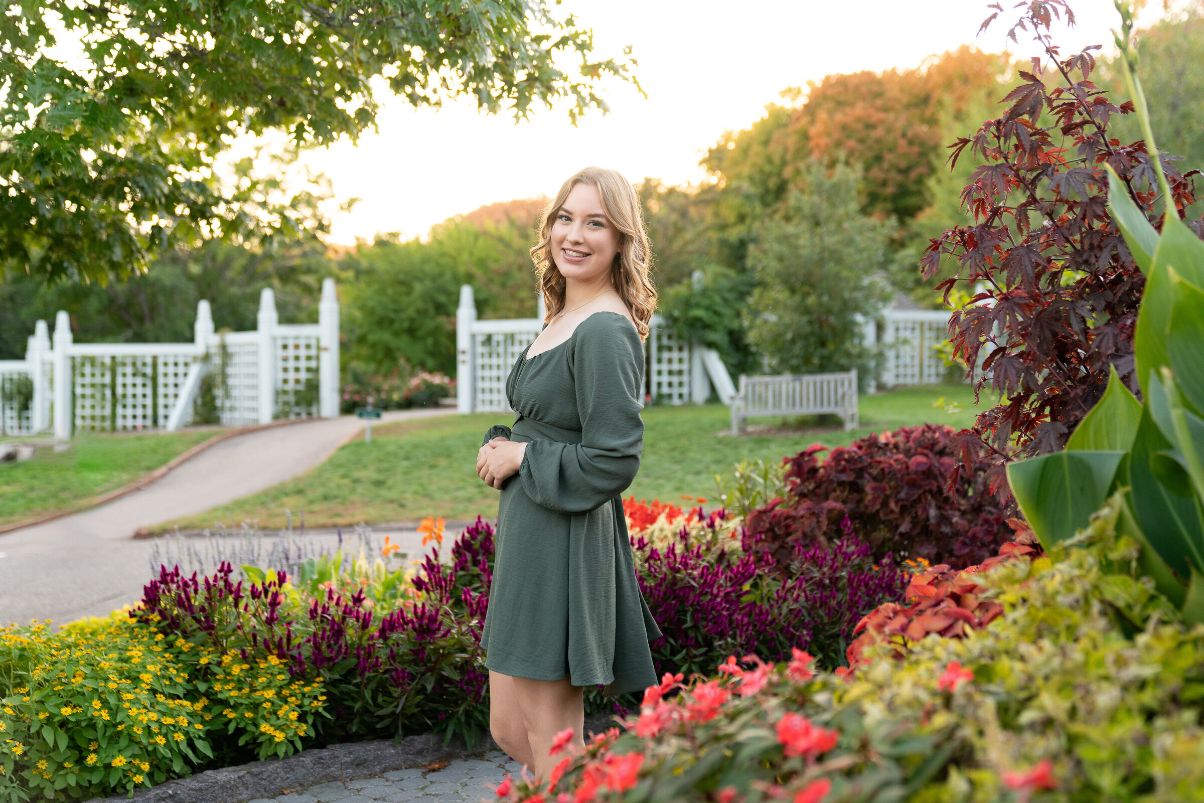 Girl stands in a flower garden at the Minnesota Landscape Arboretum in Chaska, Minnesota