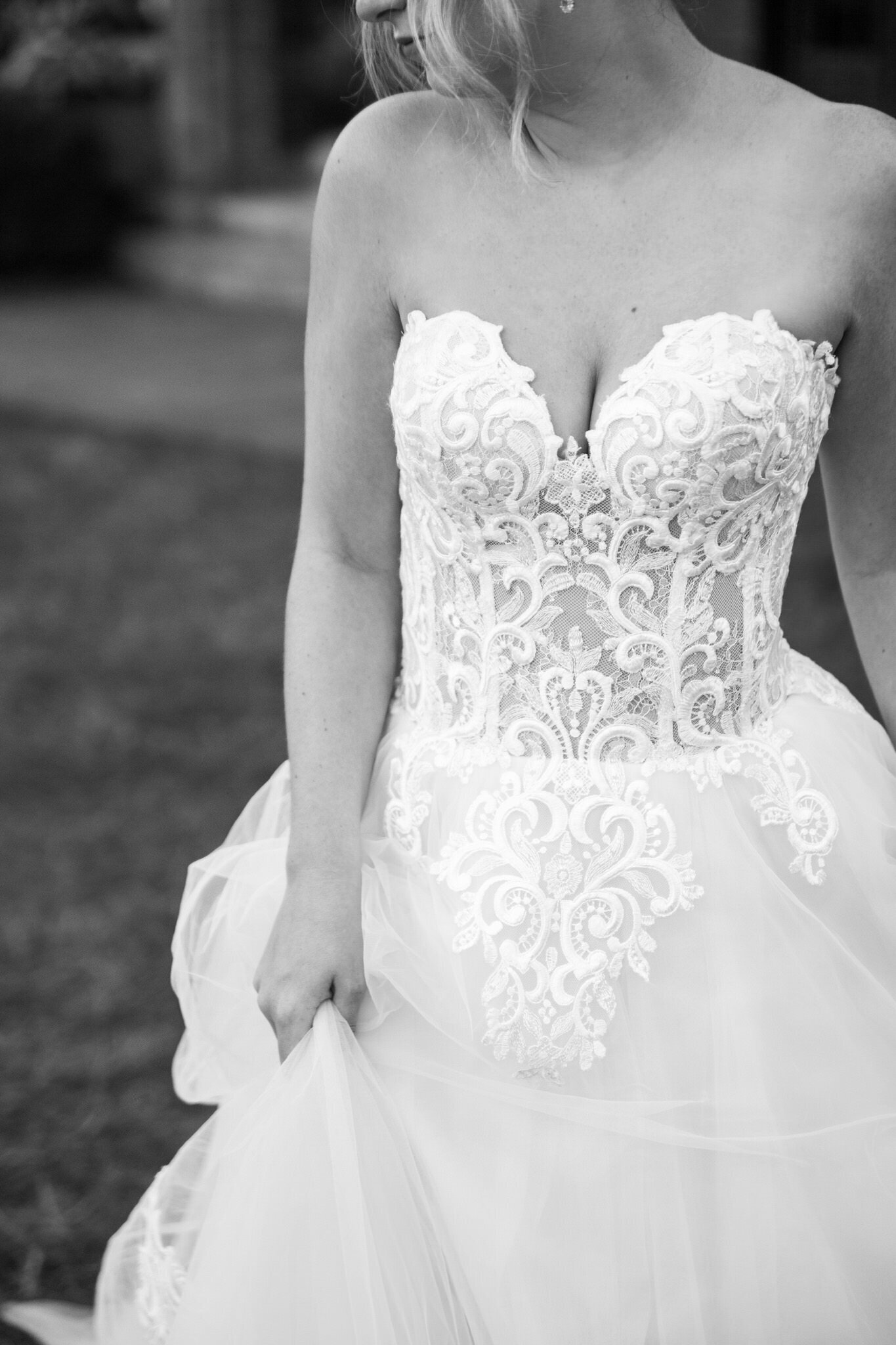 black and white photo of a strapless lace wedding dress