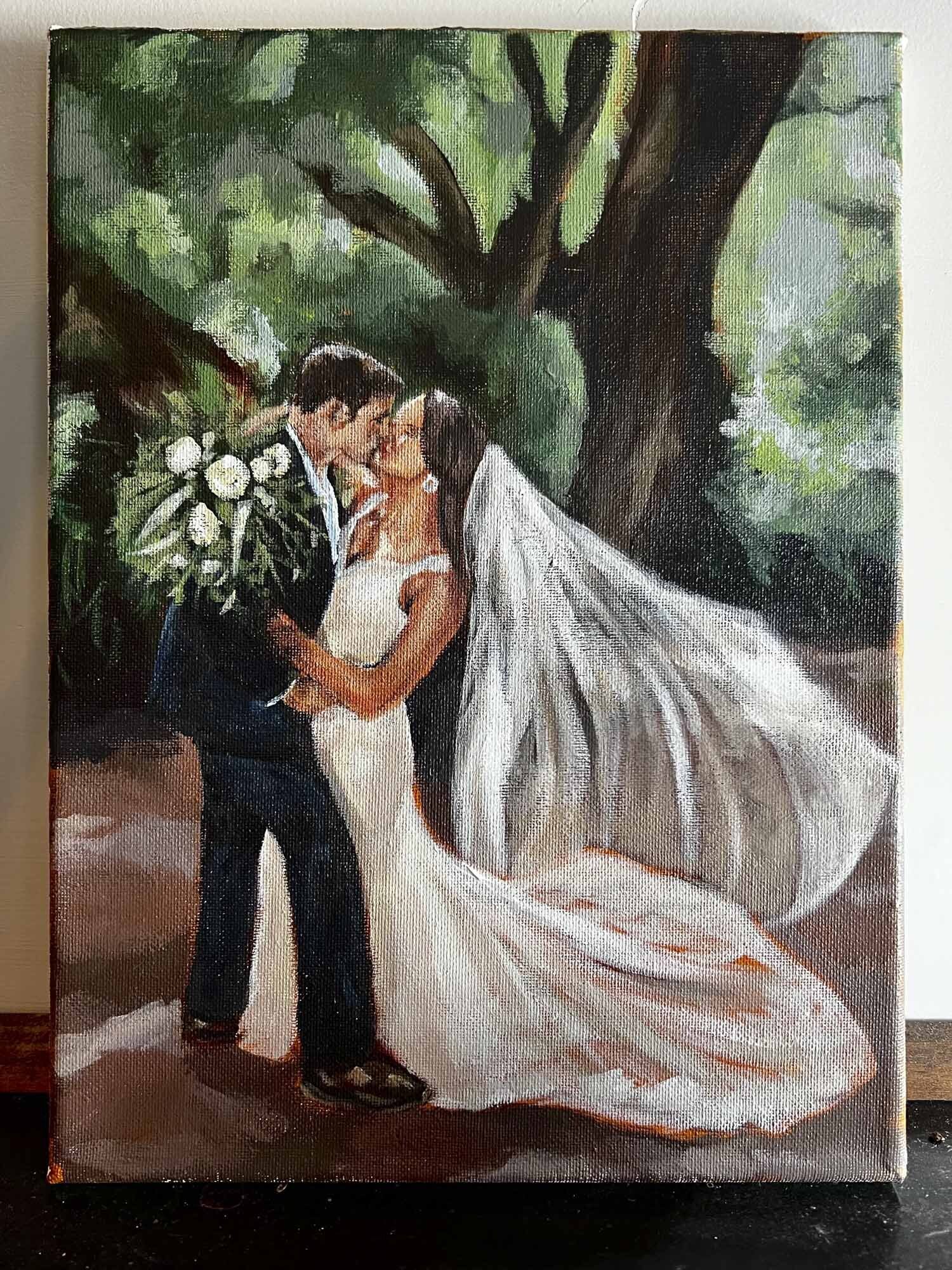 Painting of a bride and groom kissing with veil flowing