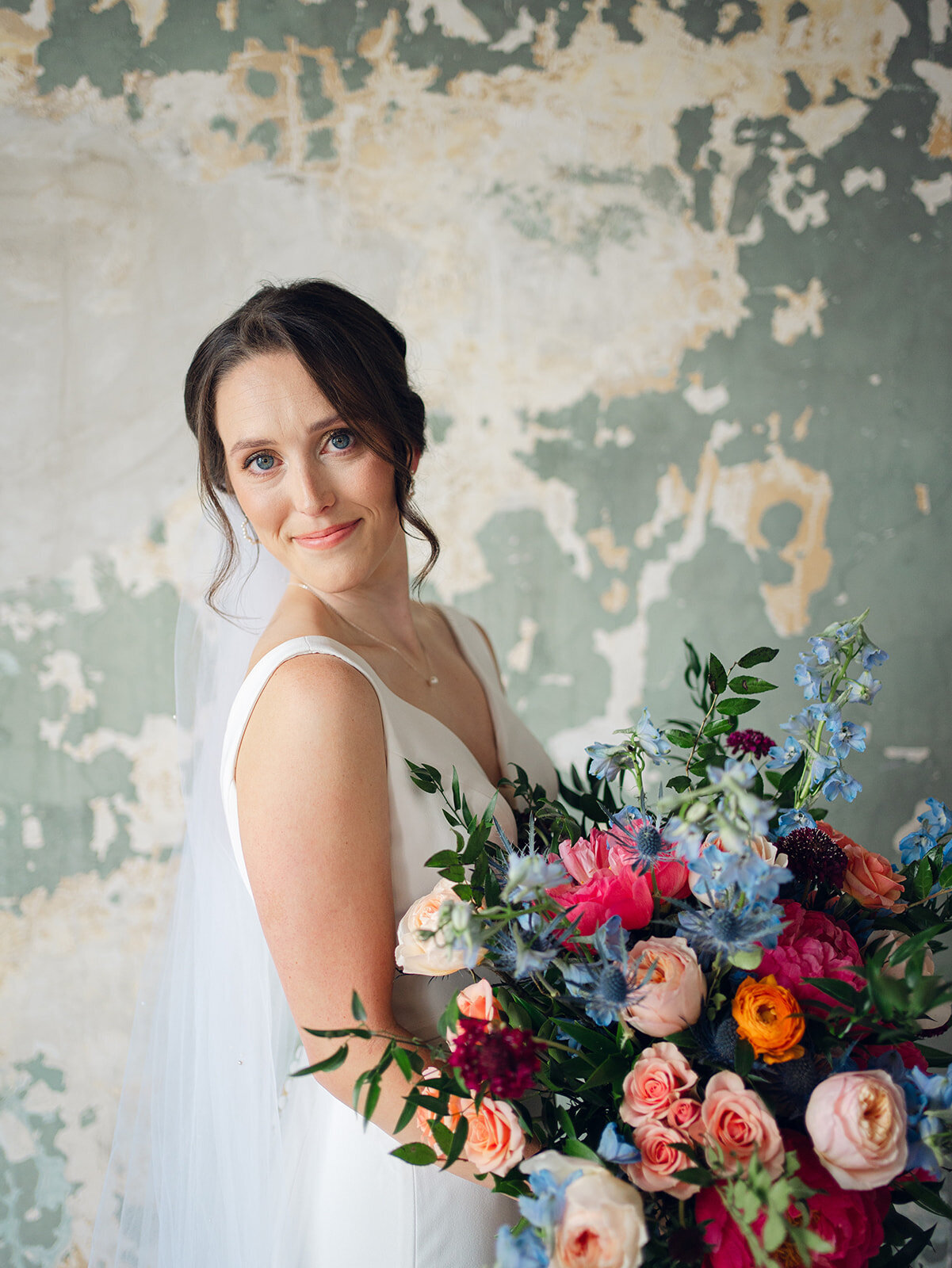Bride holding a colorful bridal bouquet for her Knoxville wedding