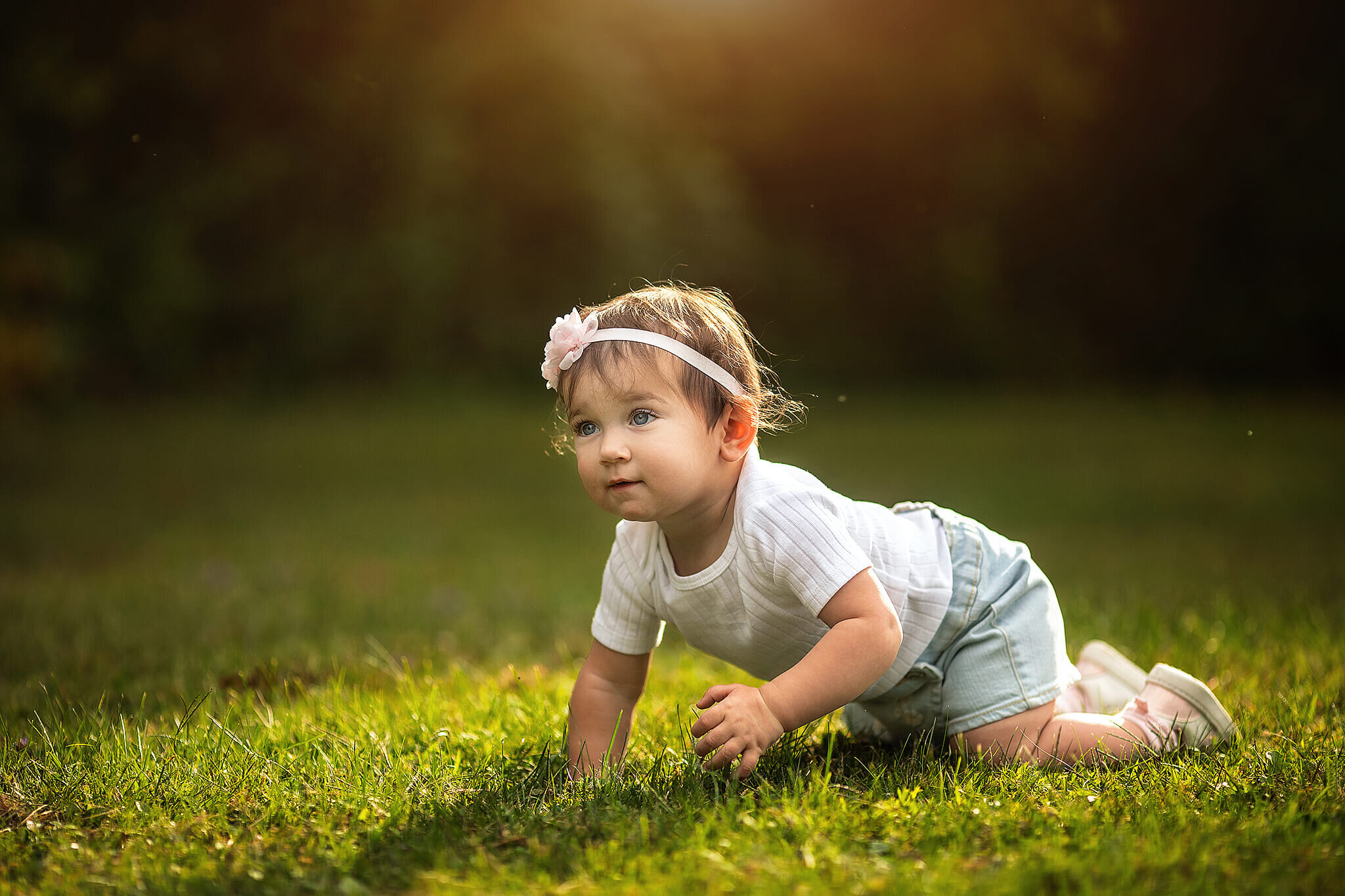 1 year old girl crawling outside 