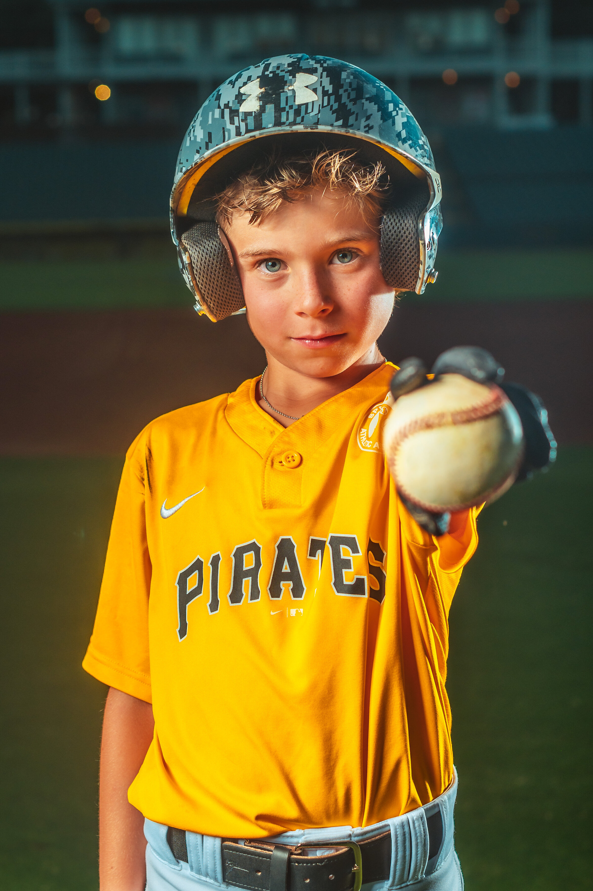 Baseball player posing with baseball