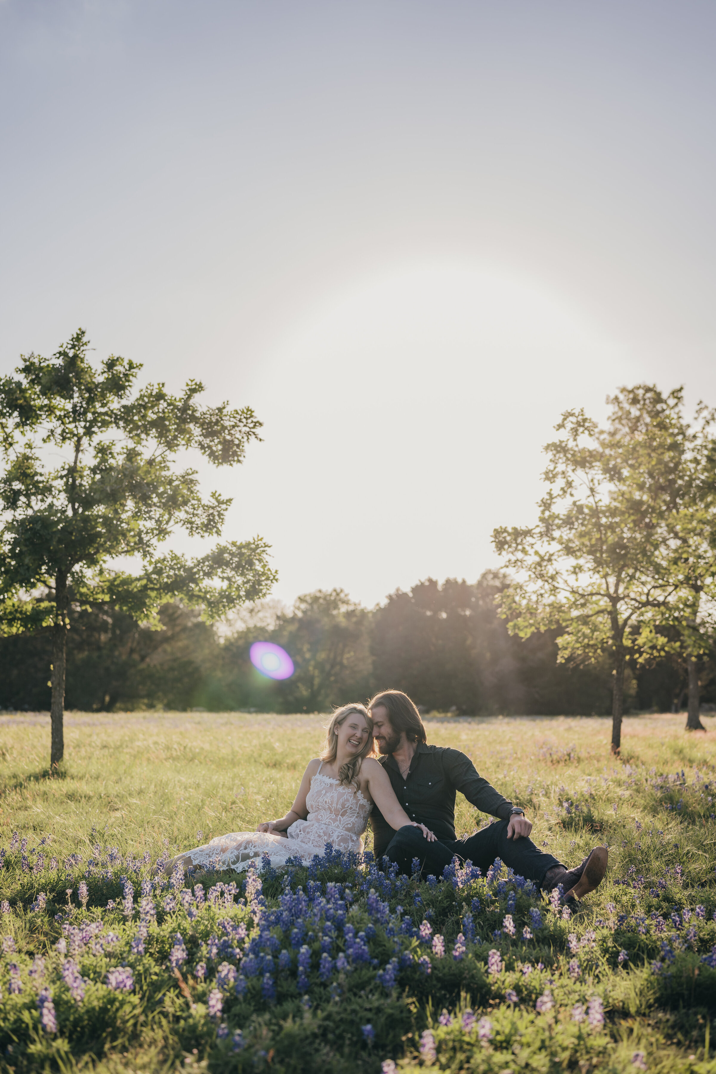 couple-sitting-in-texas-bluebonnets