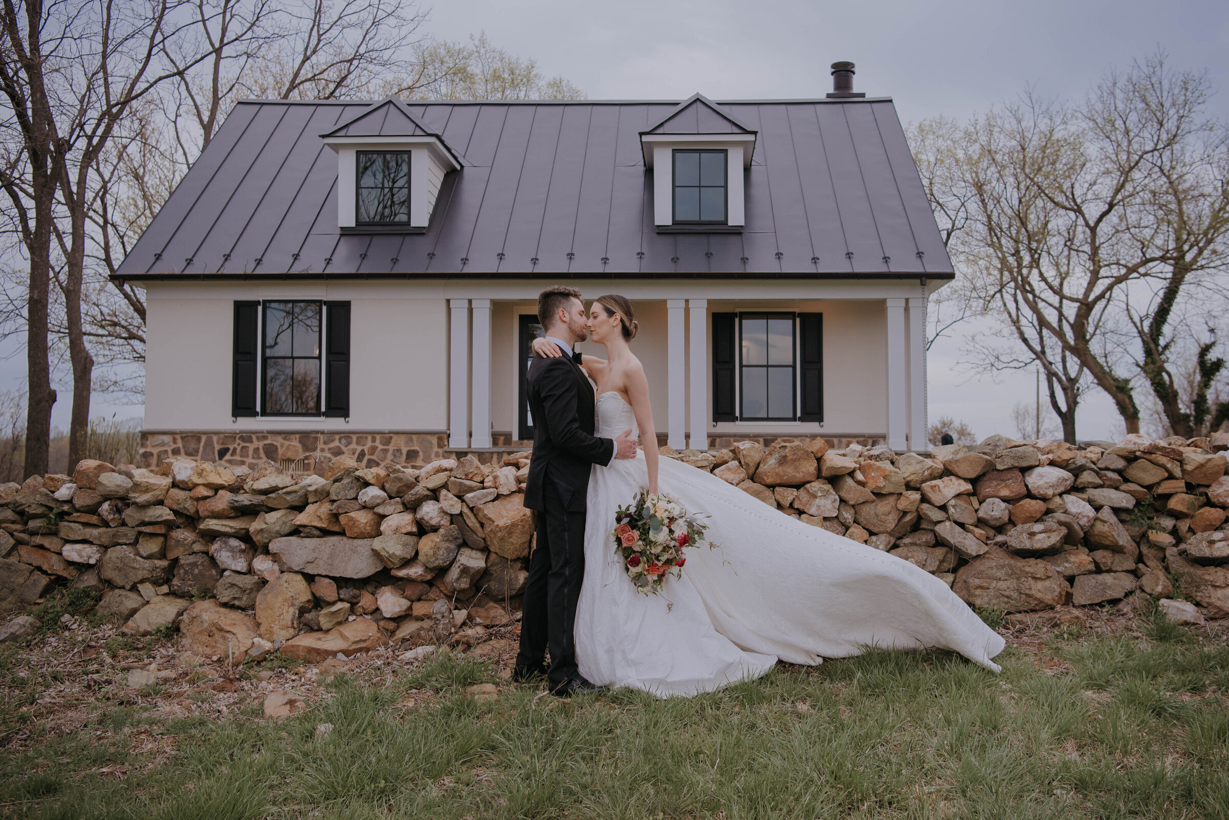 Bride & Groom in front of house