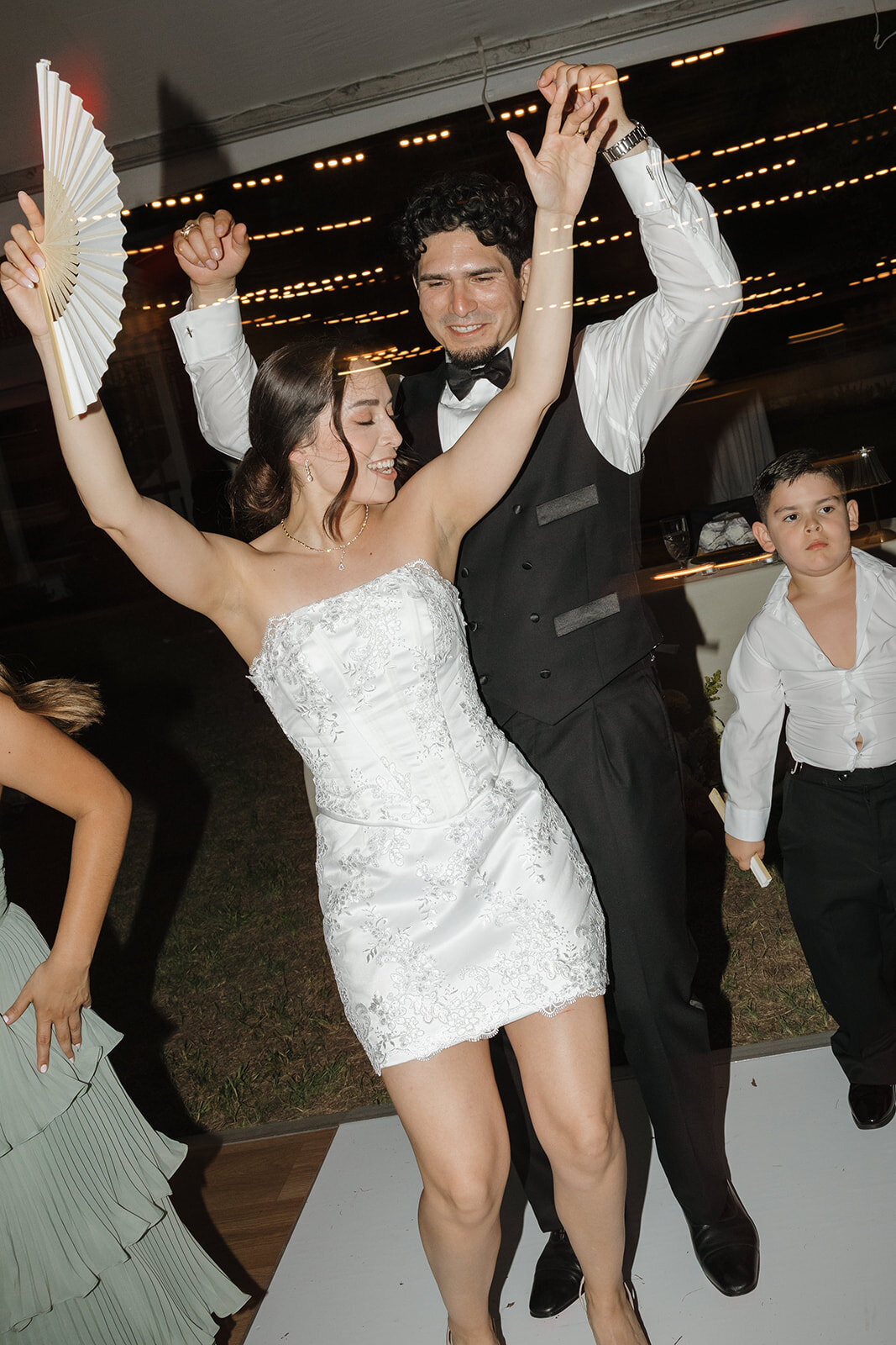 Bride and groom dancing at their wedding reception in downtown.