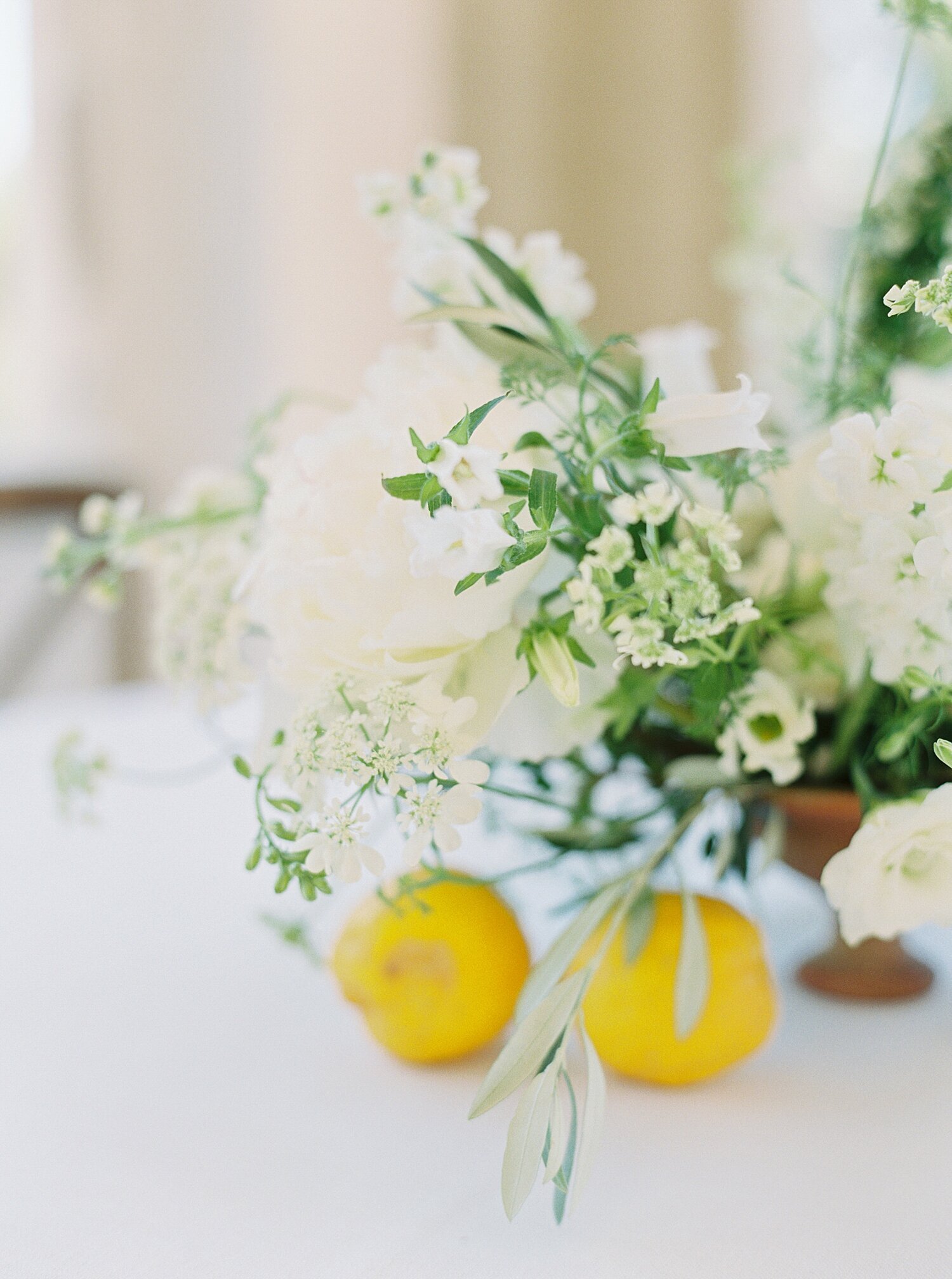 lemons and green and white florals wedding centerpiece