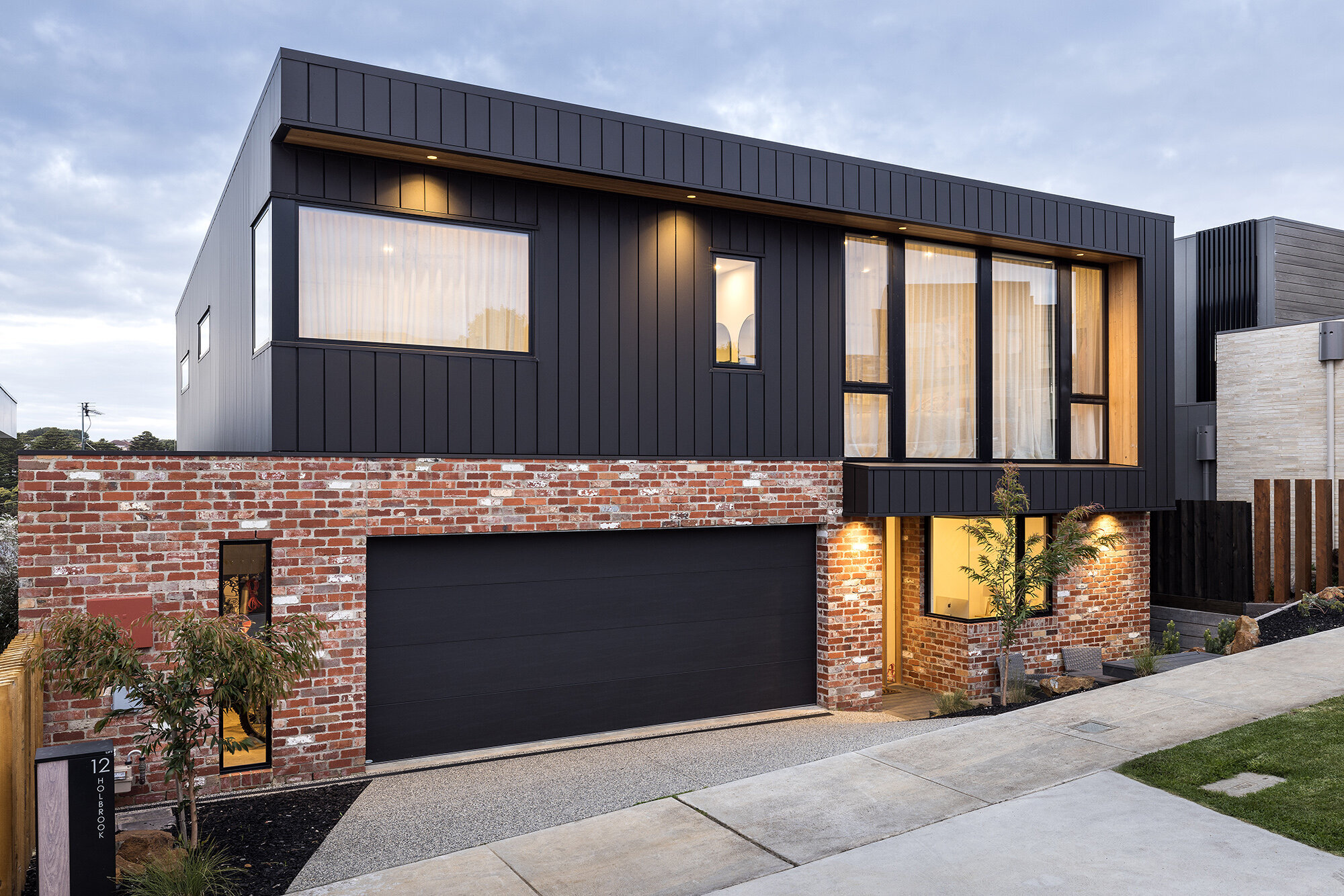Modern home design red brick and colourbond exterior