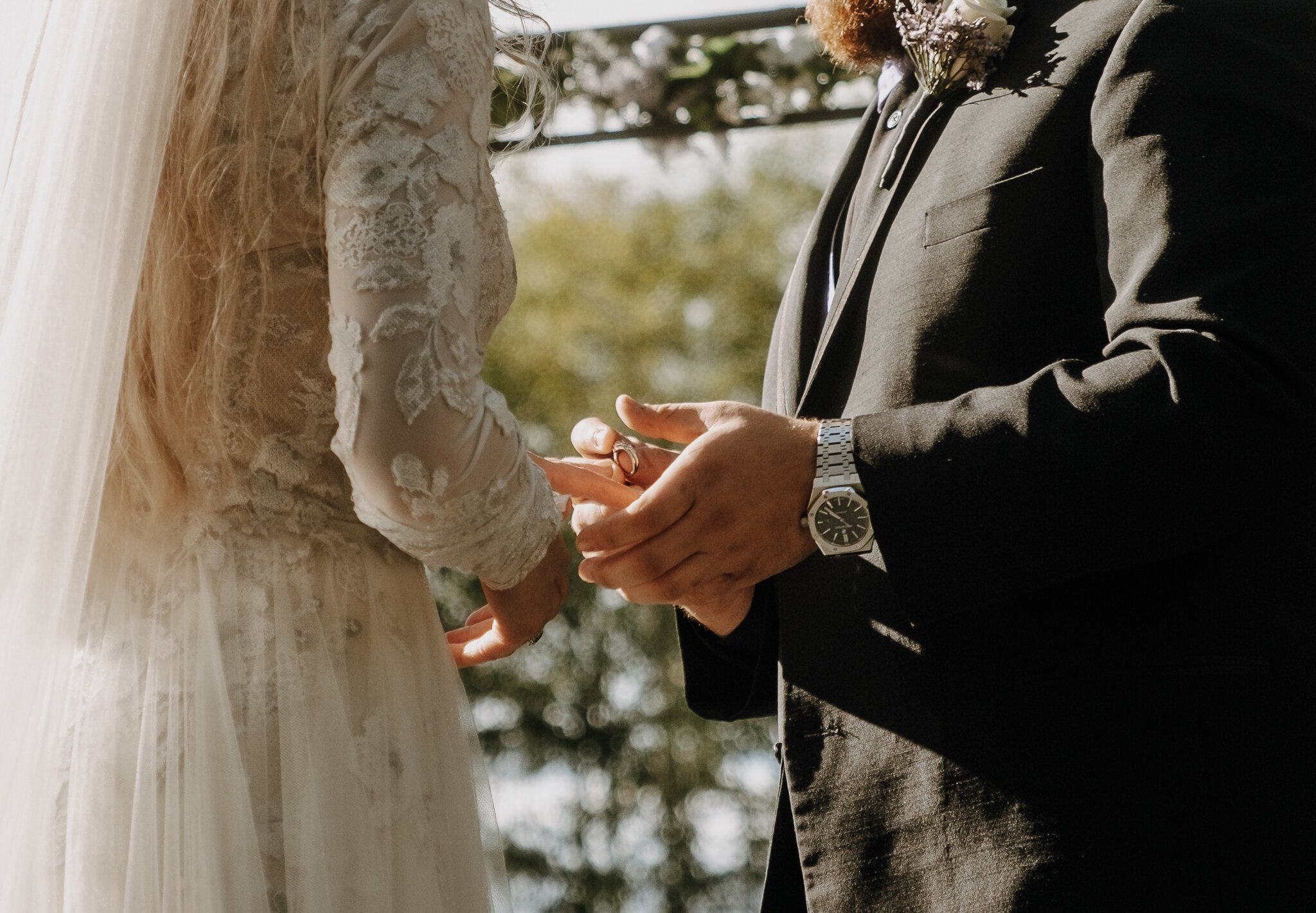 documentary style wedding photography couple exchanging rings during ceremony