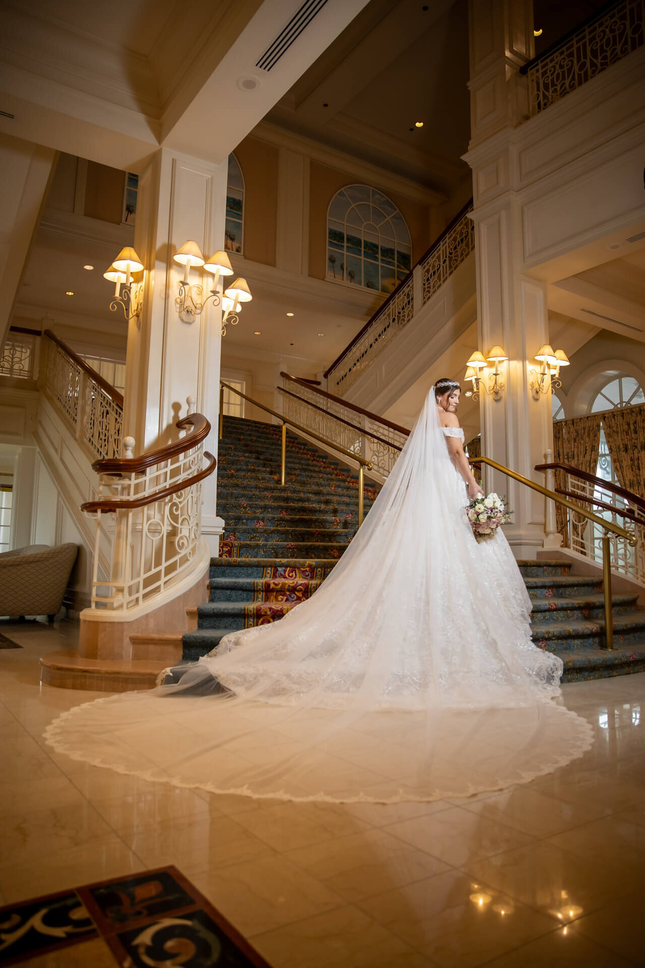 Destination-Wedding-Photographer-Disney-Veil-Train-Staircase-Grand-Floridian