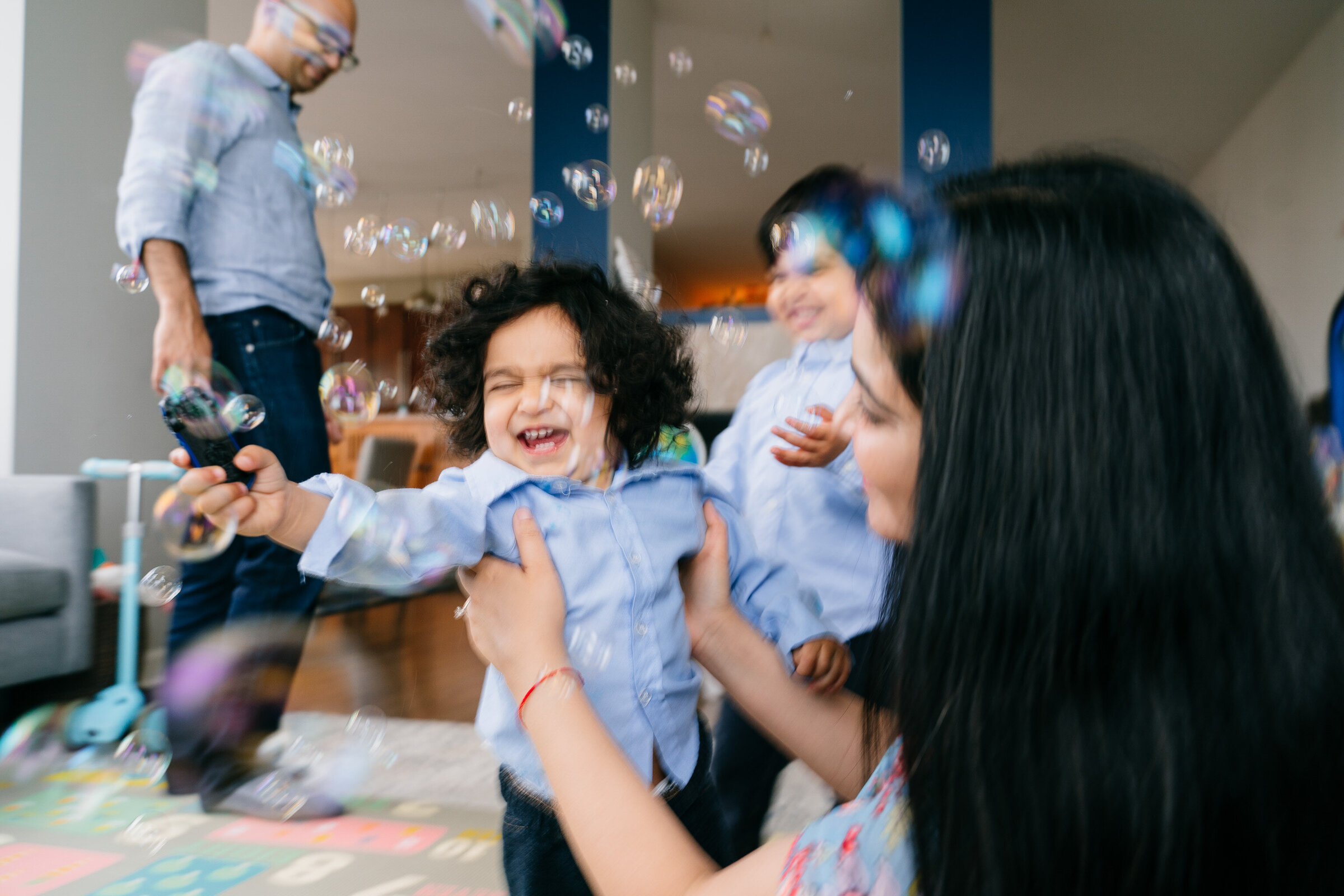 Toddler playing with bubbles