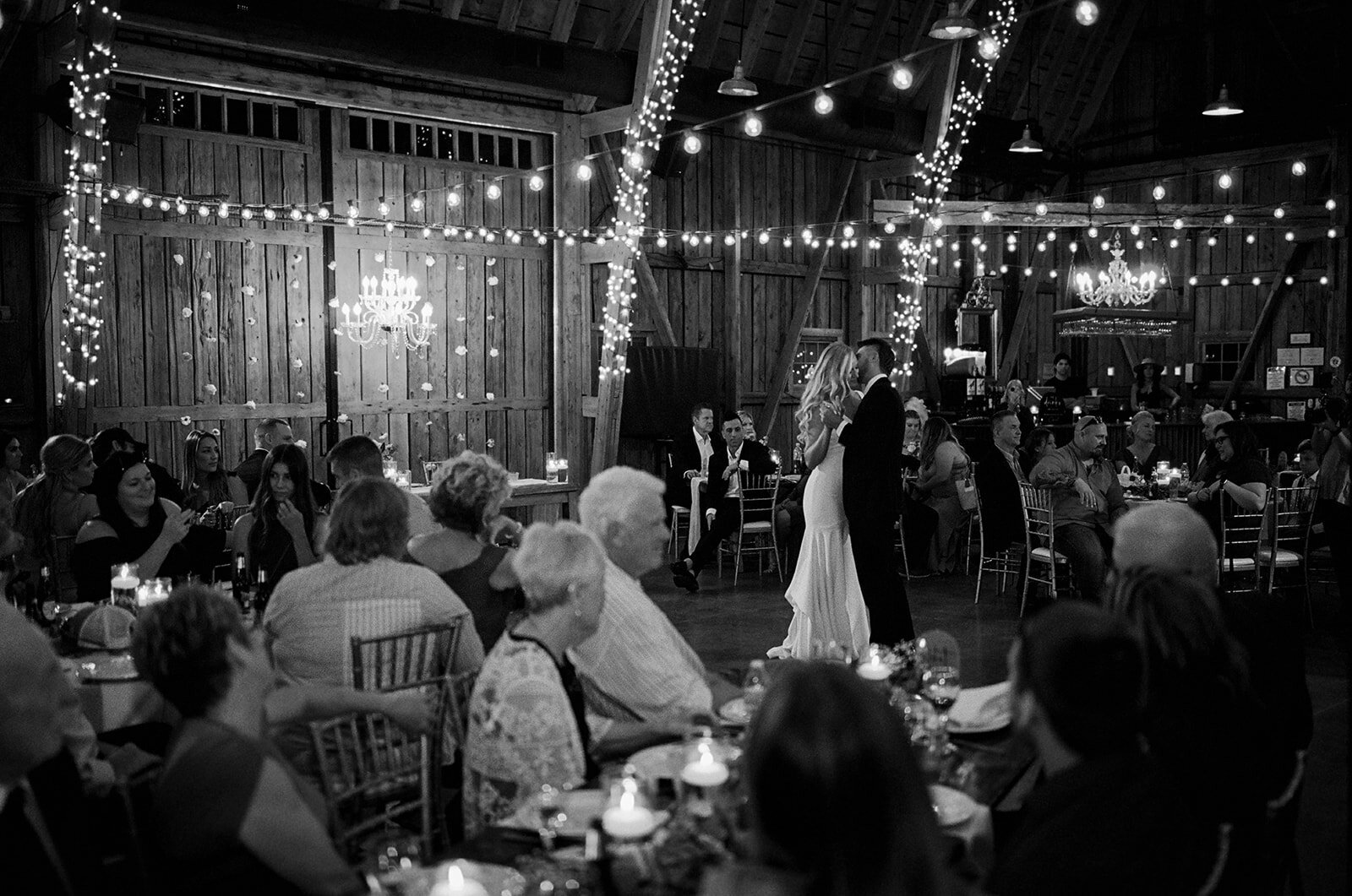 Black and white image of a couple during their first dance at the windmill winery in florence arizona