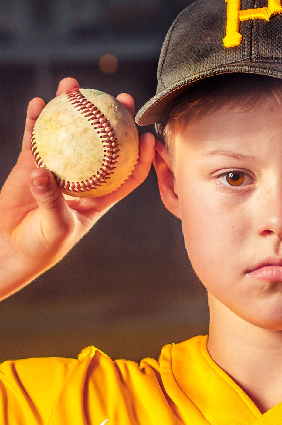 Baseball player posing with baseball