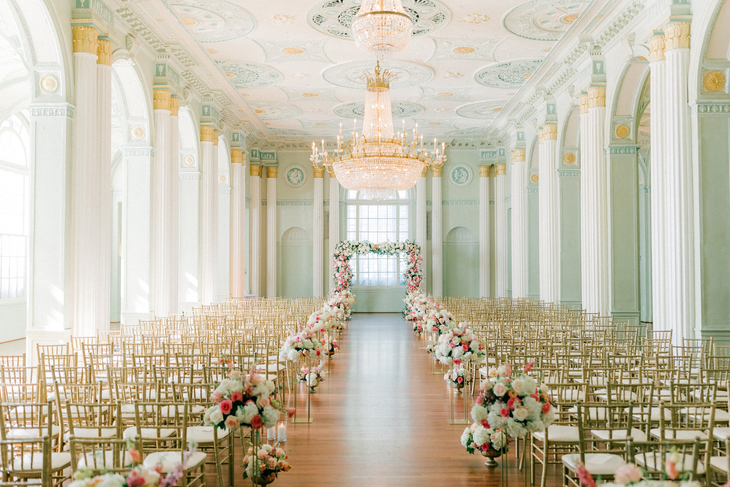 Biltmore Ballrooms with gold chairs and pink flowers