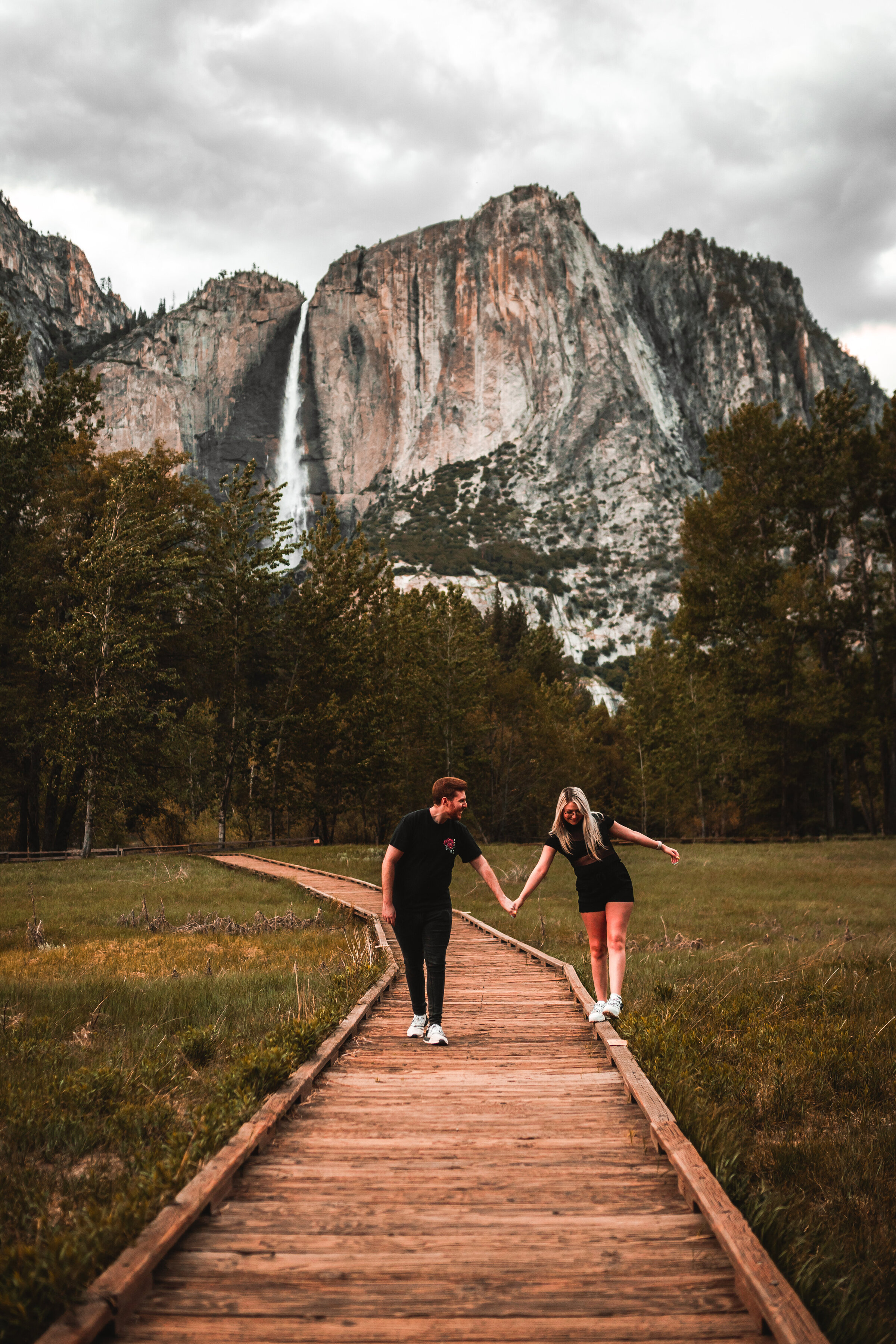 Yosemite engagement photos with waterfall and mountain
