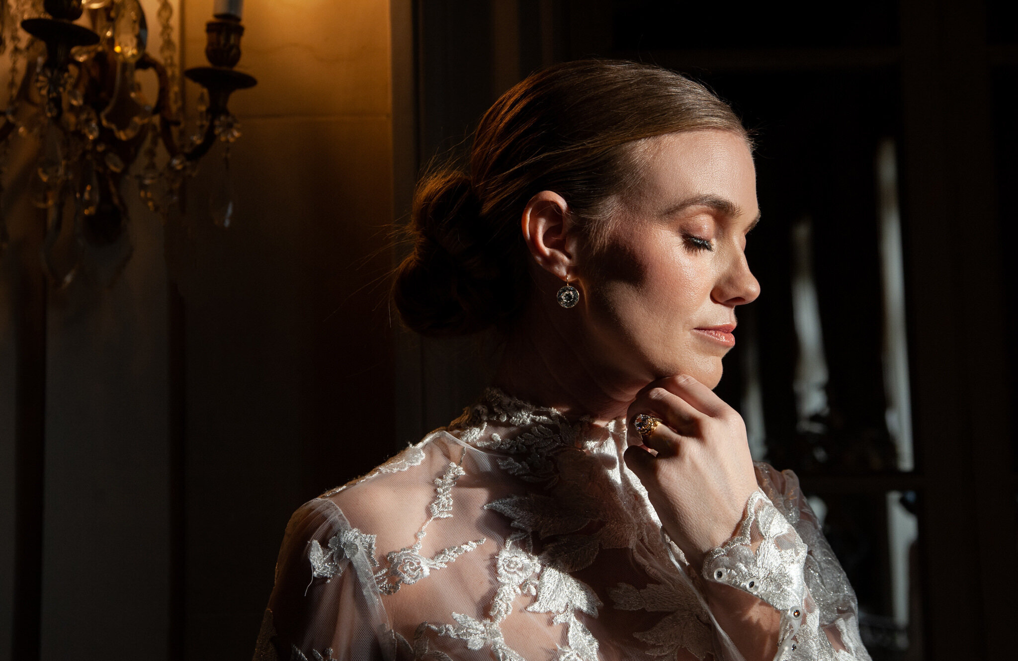 portrait of a bride looking down at sunset