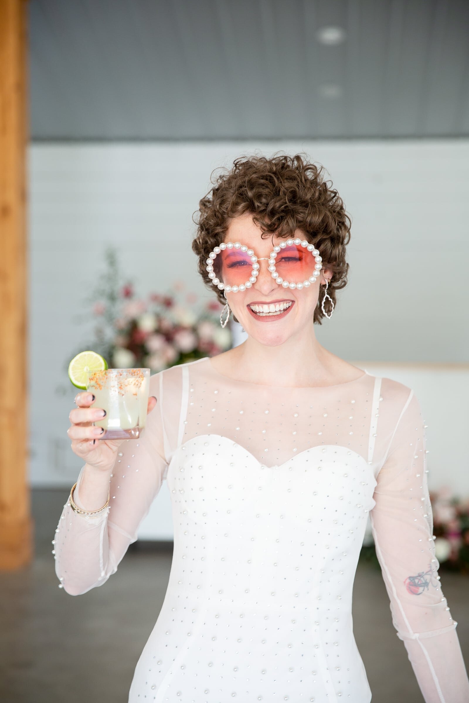 bride wearing fun glasses  during wedding reception at Walnut Hill Raleigh