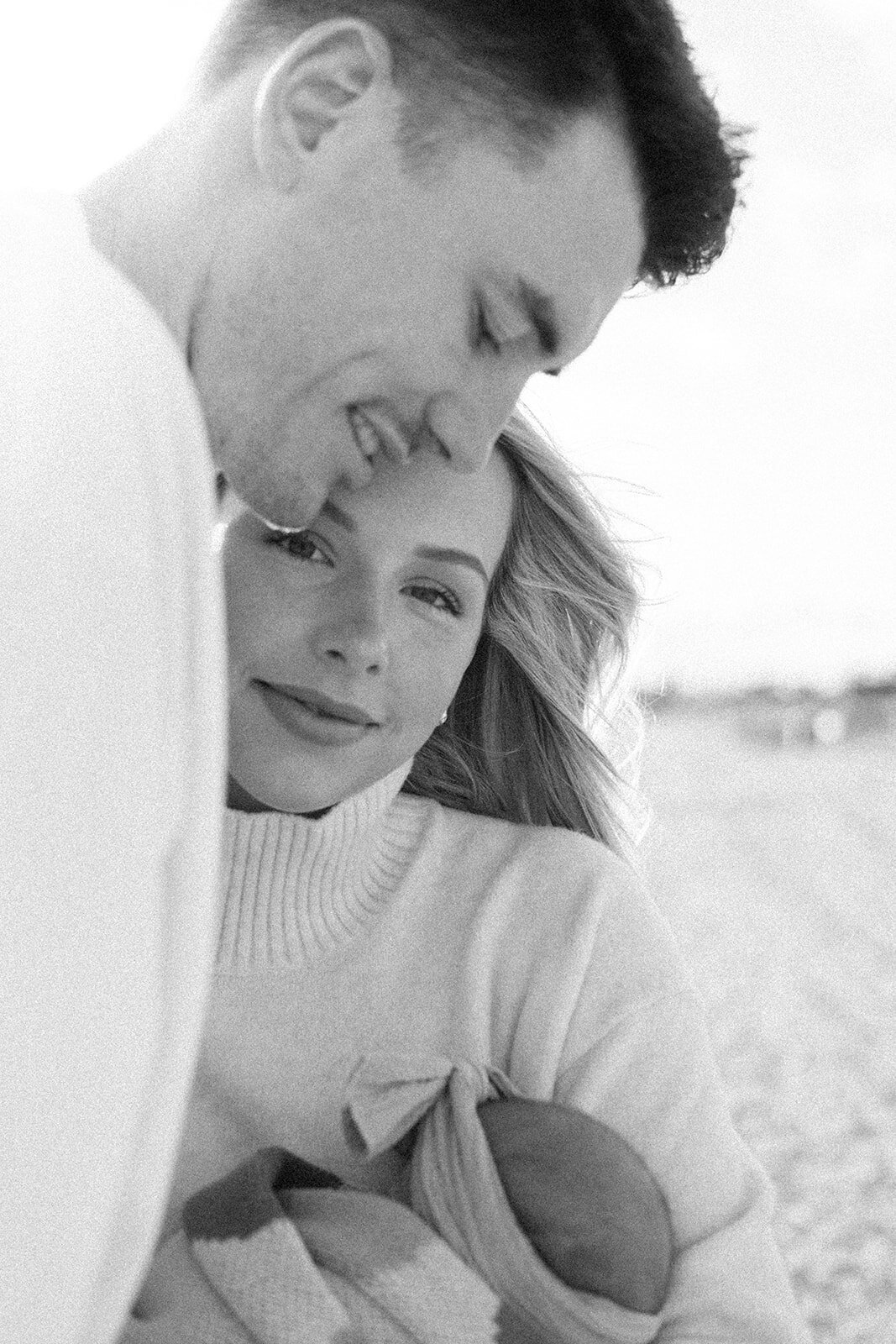 parents with baby at beach Chelsea