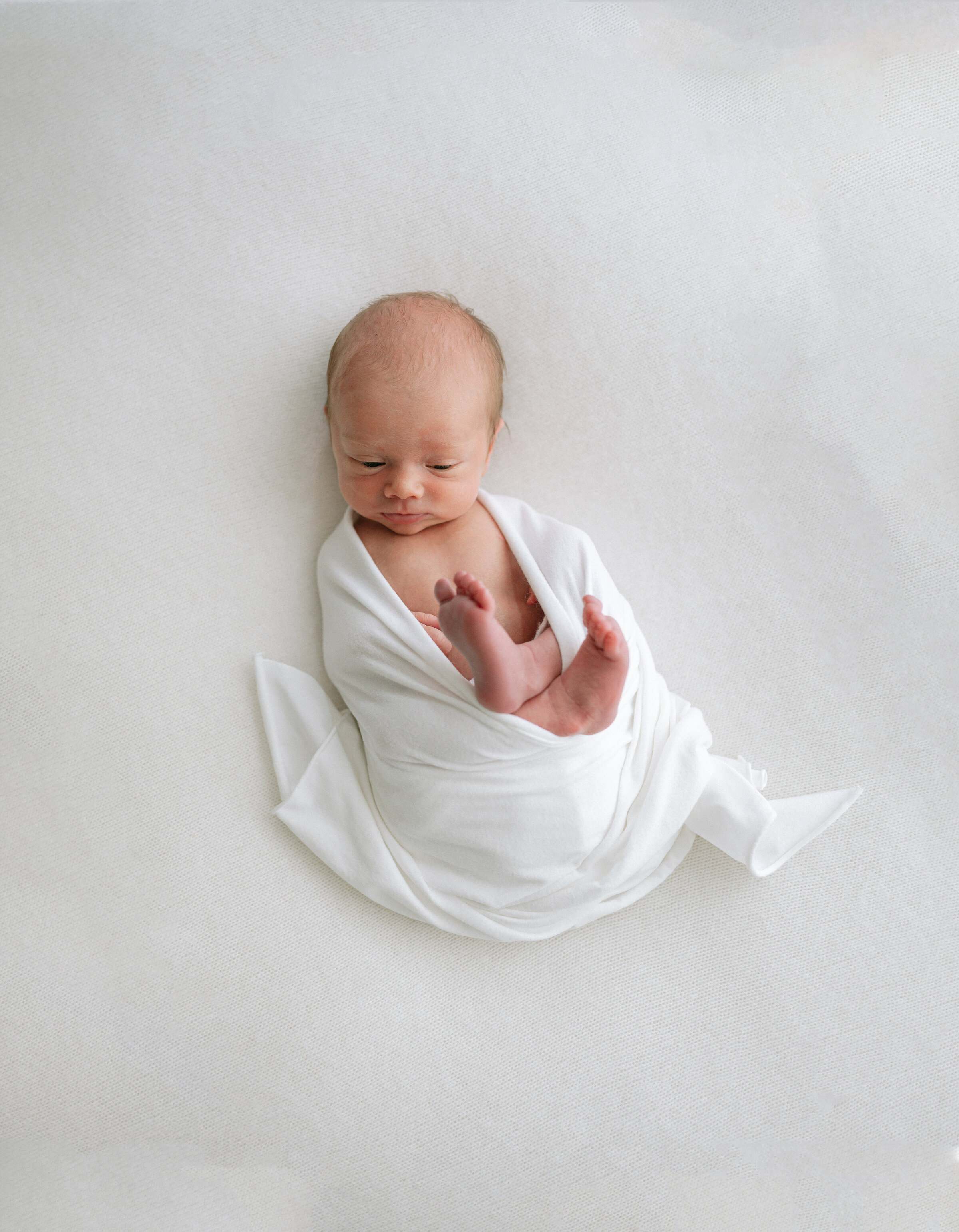 overhead shot of newborn baby at newborn photography studio in central York near me