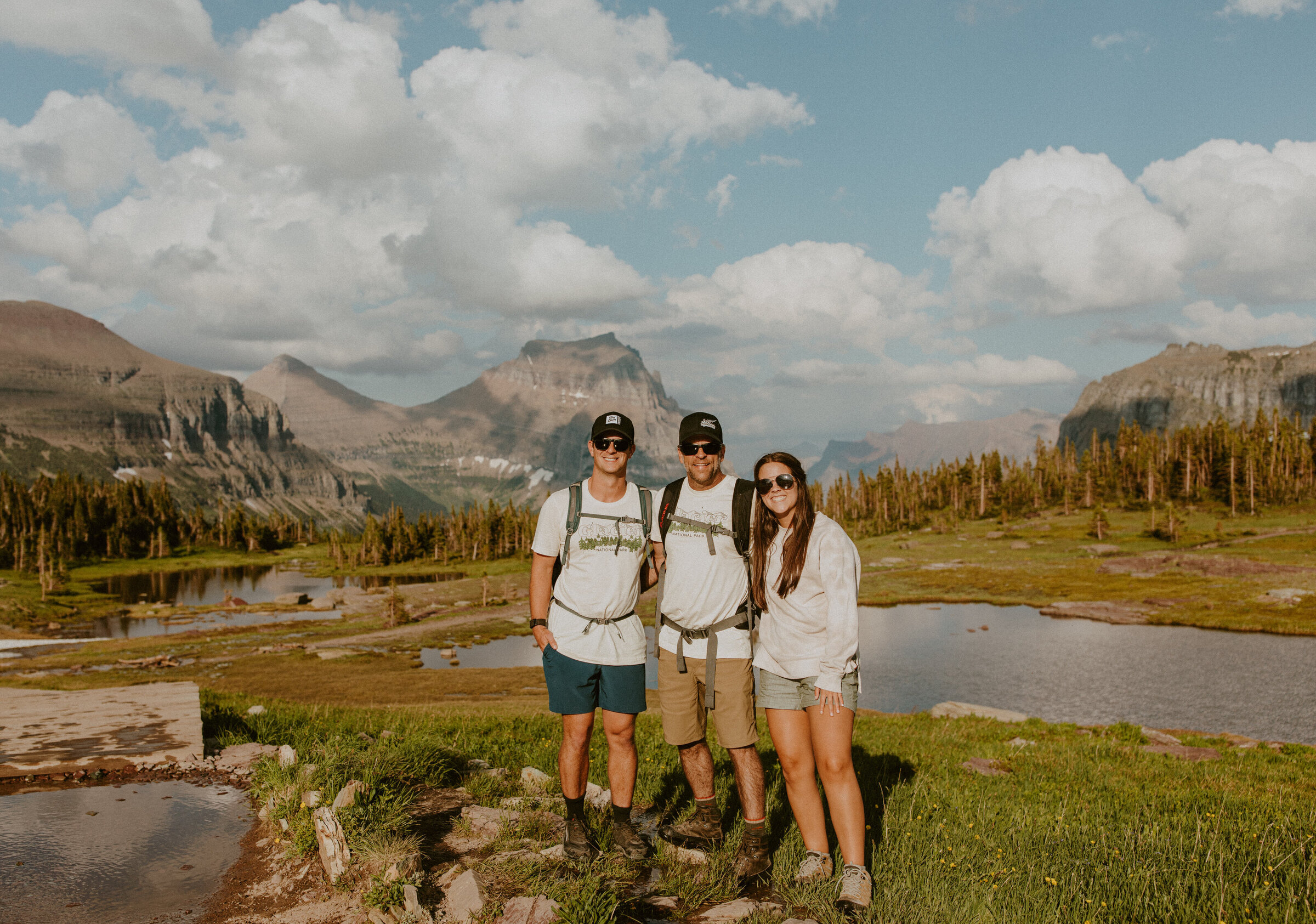 A family hiking during the summer in Glacier National Park in Montana.