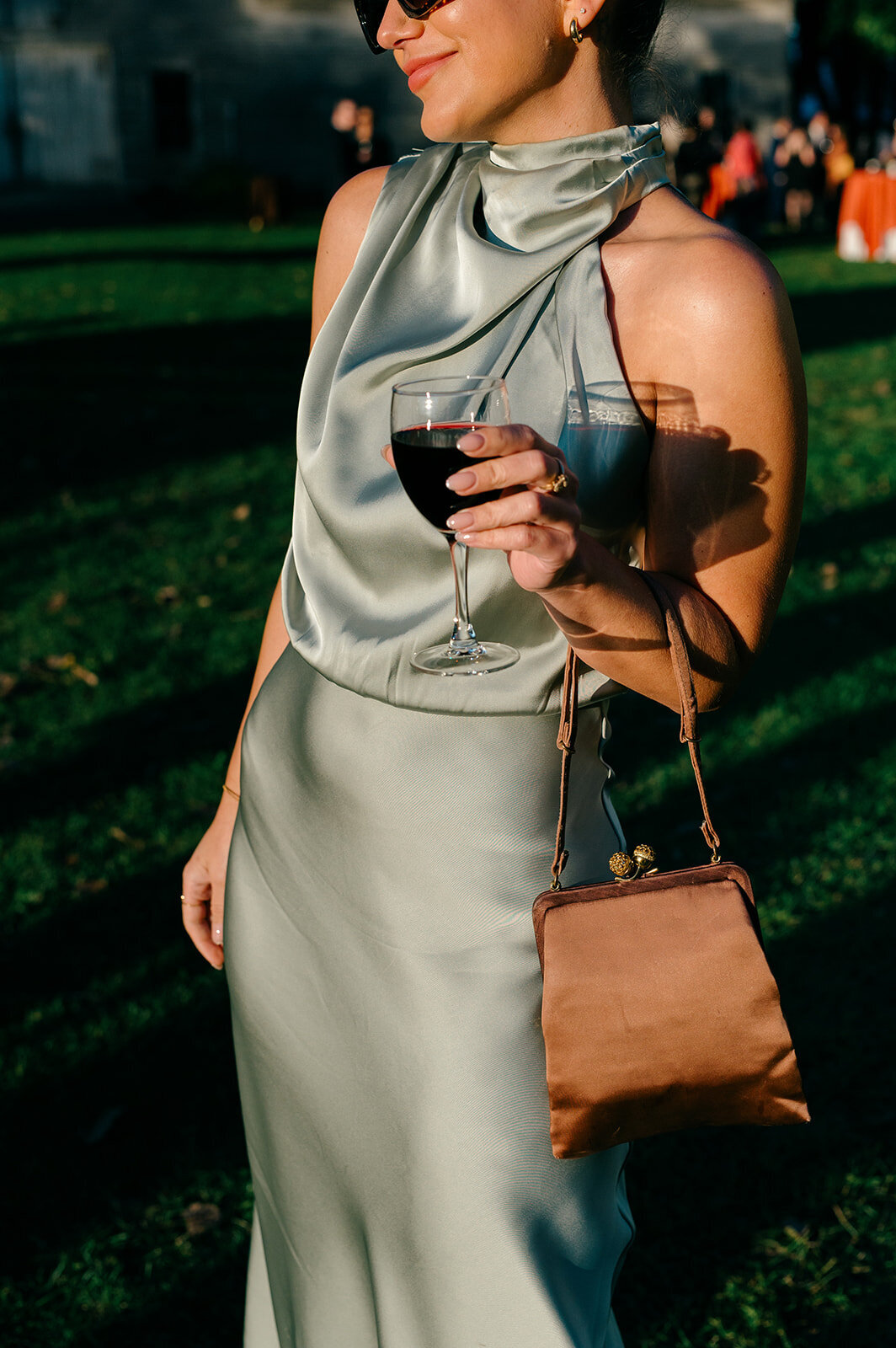 guest at a wedding on the shores of lake champlain by basin harbor wedding photographer