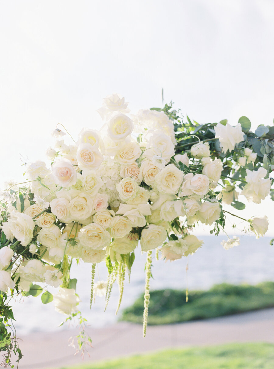 white and green floral arch up close photo