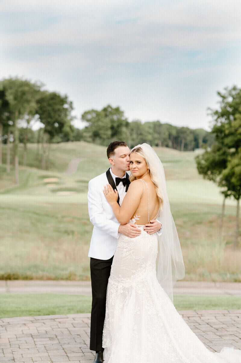 bride and groom smiling by wedding photographers in lexington