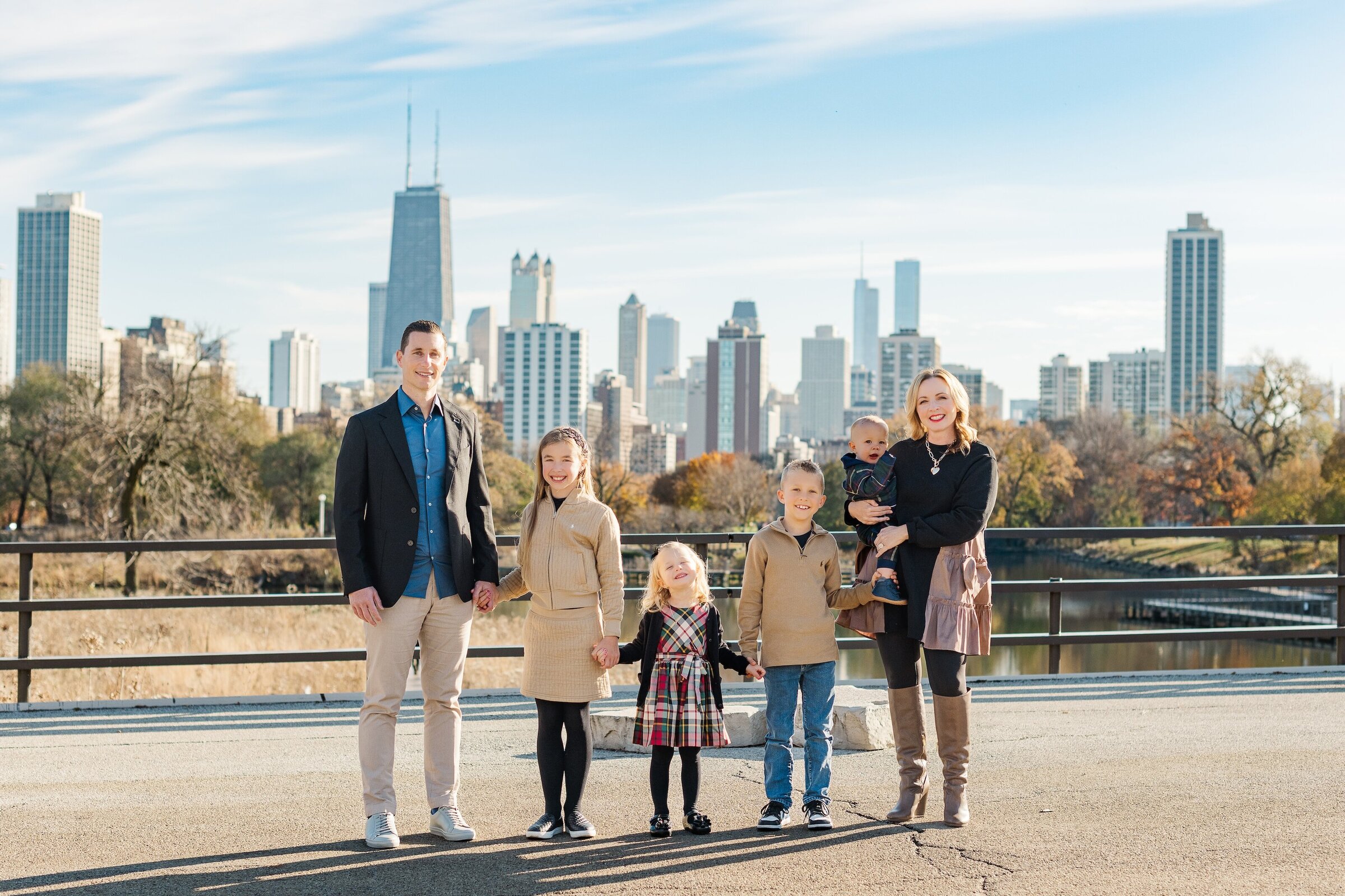 woman holding flower sitting in tulip field