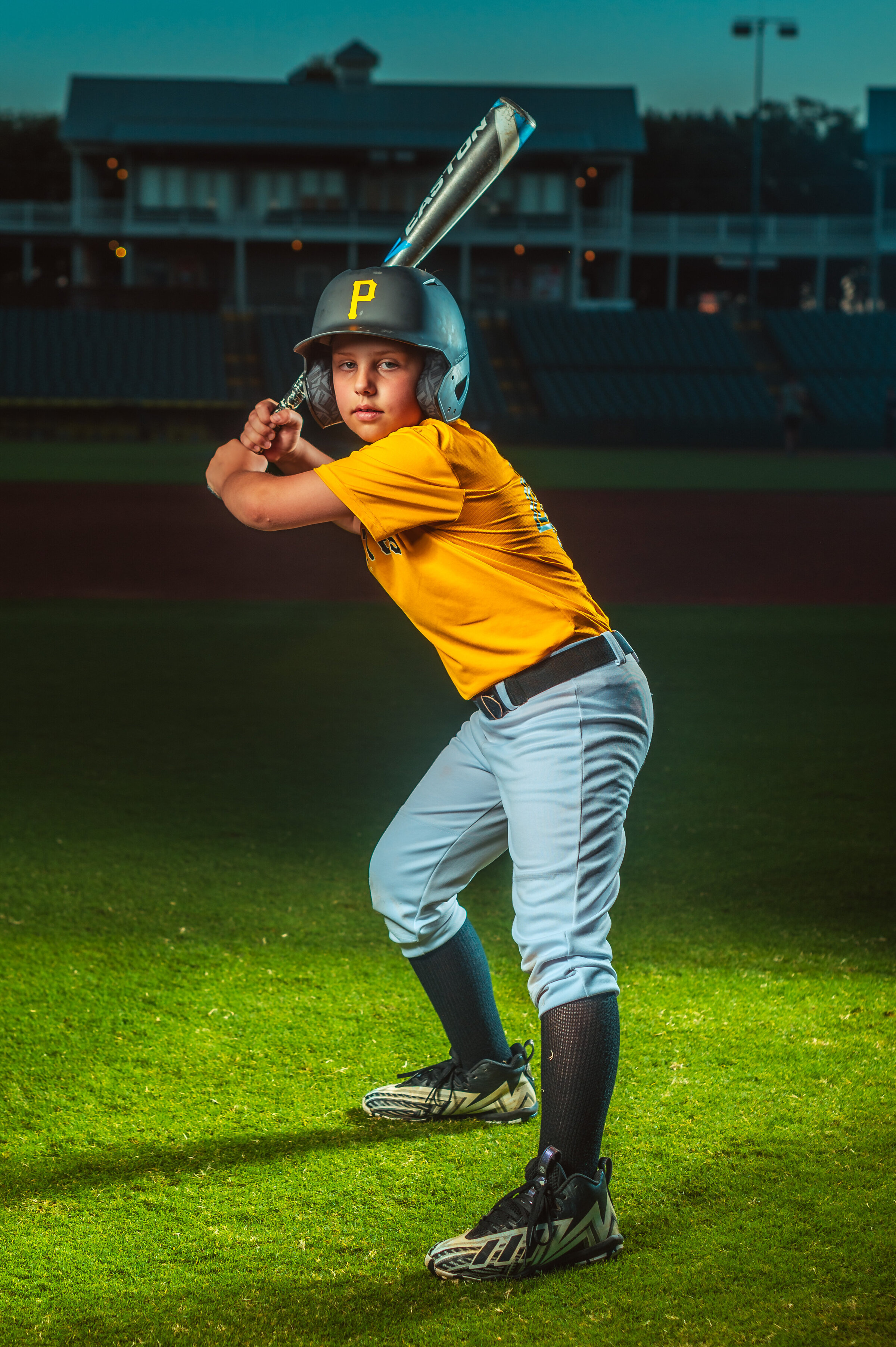 Baseball player posing with bat