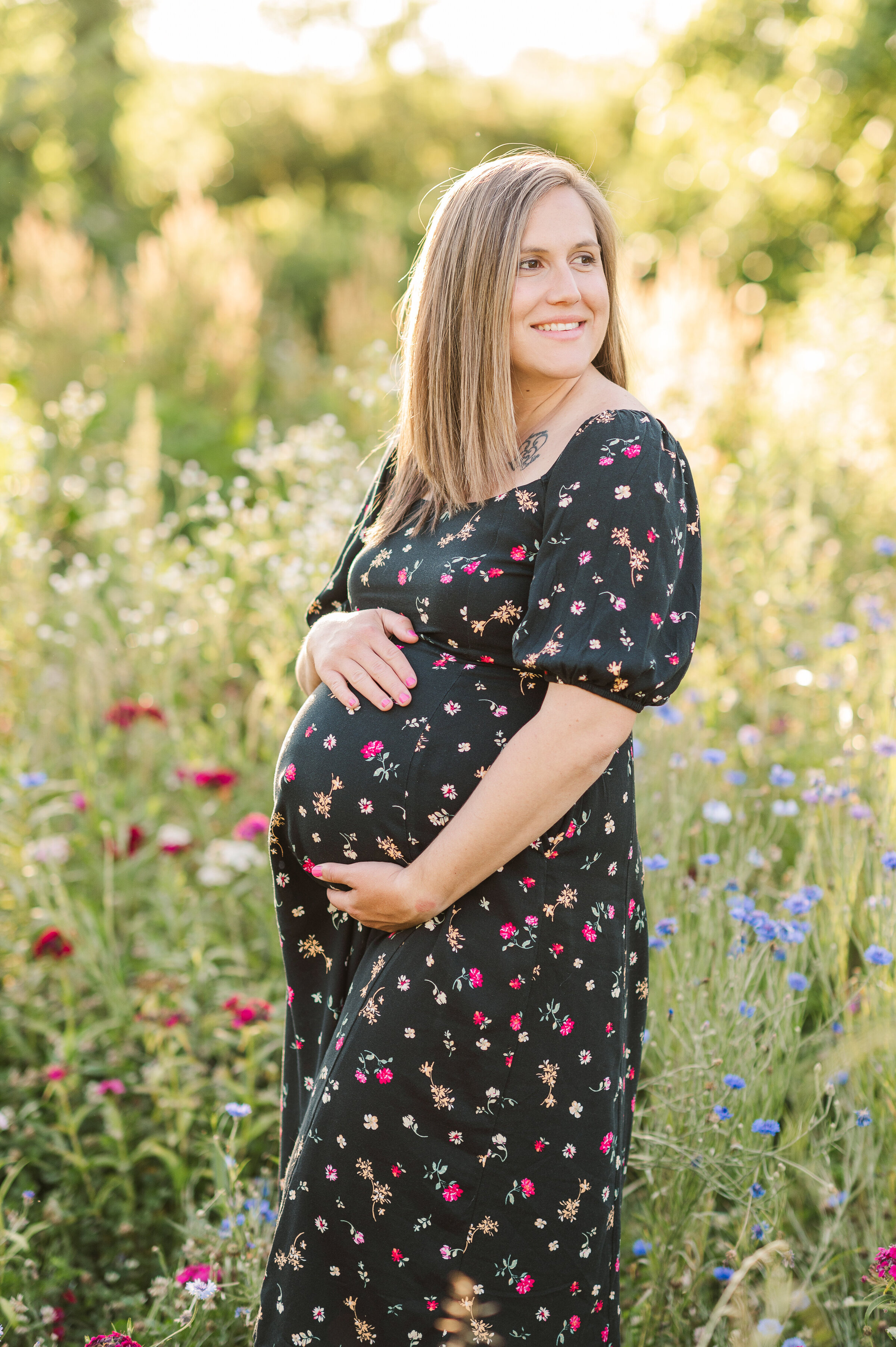 Mother holding belly by maternity photographer york pa