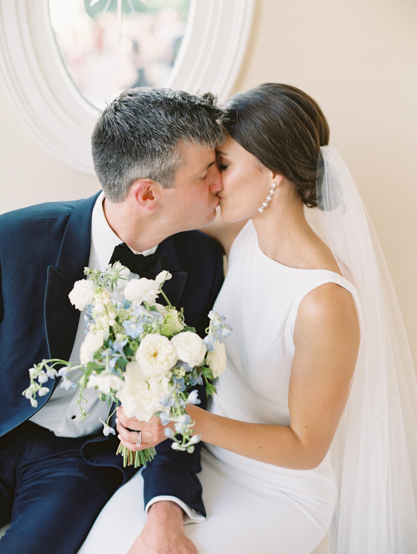 bride and groom kissing up close photo on film